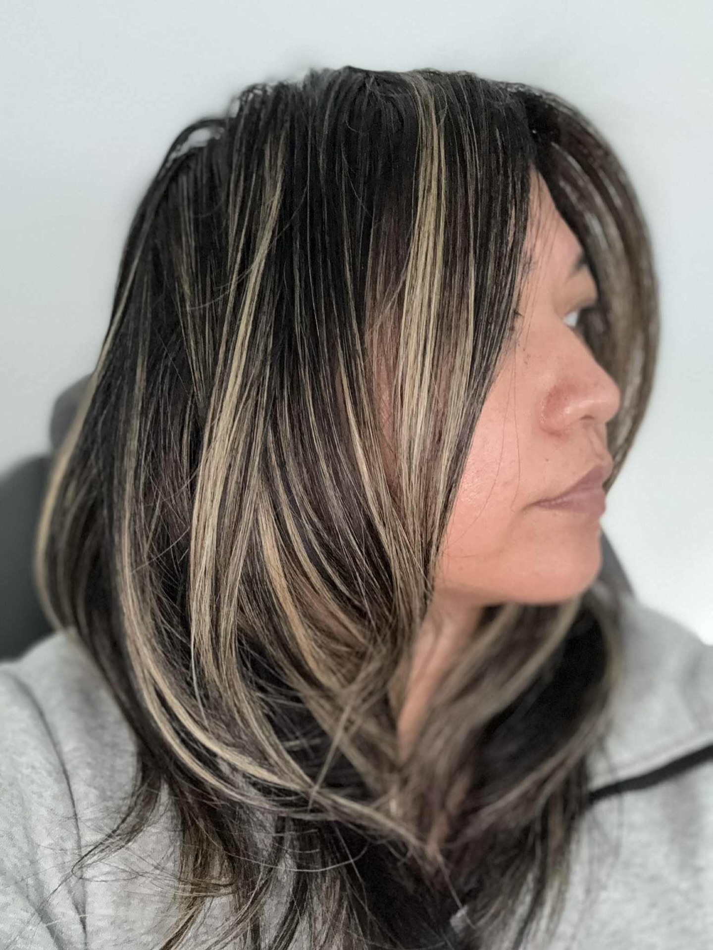 My beautiful client wanted a partial highlight. I gave her an airtouch partial foil, did a little root shadow and toned the ends. This is a great low maintenance haircolor for a woman on the go.
