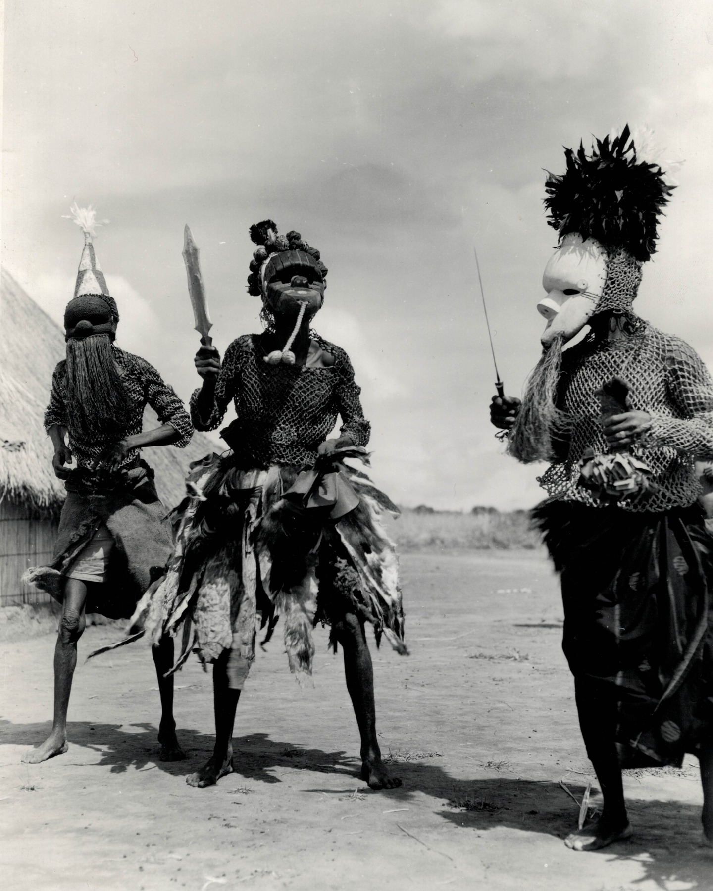 Picture of the day #127.
Photographer: Lamote, Carlo (1928 â 2017).
Title: untitled ( Danse Mfuku).
Date: 1958.
Country: Democratic Republic of the Congo.
Medium: unmounted gelatin silver print.
Size: 23,6 x 17,3 cm.
Condition: very good.
Reference: CLV1119/1.
Provenance: French collection.
Extra: typed note with identification in French and Dutch and stamp on verso. Congopresse 31.406/31.
Mfuku dance performed by the Basala Mpasu (Salampasu). The Mfuku dance is an important part of the cultural and spiritual traditions of the Salampasu people, and is often performed at ceremonies, rituals, and other important events as a way to honor the ancestors and promote harmony and unity within the community. The Mfuku dance is also a traditional dance performed in times of illness. It is believed that the sick who perform this dance will become healthy again. The combination of the masks, clothing, and props creates a visually striking and impactful performance that is deeply rooted in the cultural traditions of the Salampasu people. The Basala Mpasu (Salampasu, meaning grasshopper wings) are named for the tattoos in the shape of grasshopper wings that adorn their foreheads. The Basala Mpasu are found west of the Lulua River.
Location: Mukasa or Salushimba.
Territory: Louiza.
Province: KasaĂŻ (current name = KasaĂŻ-Central).
Photographer and cameraman Carlo Lamote (1928-2017)) left for Congo in 1950 to work for the colonial information service. For ten years, he travelled to every corner of the Congo, Rwanda and Burundi to highlight the colonial achievements. Propaganda is the name of the game, but he turned out to be an excellent photographer. Together with his colleague Henri Goldstein, Lamote has shaped our image of the Belgian Congo. Open any book about the 1950s in the colony and you will find their names under the photos.
After independence, he set up his own film production company and news agency, with Visnew, ABC and CBS as regular customers. He was also the founder of Congovox, the news service of the Congolese state broadcaster.