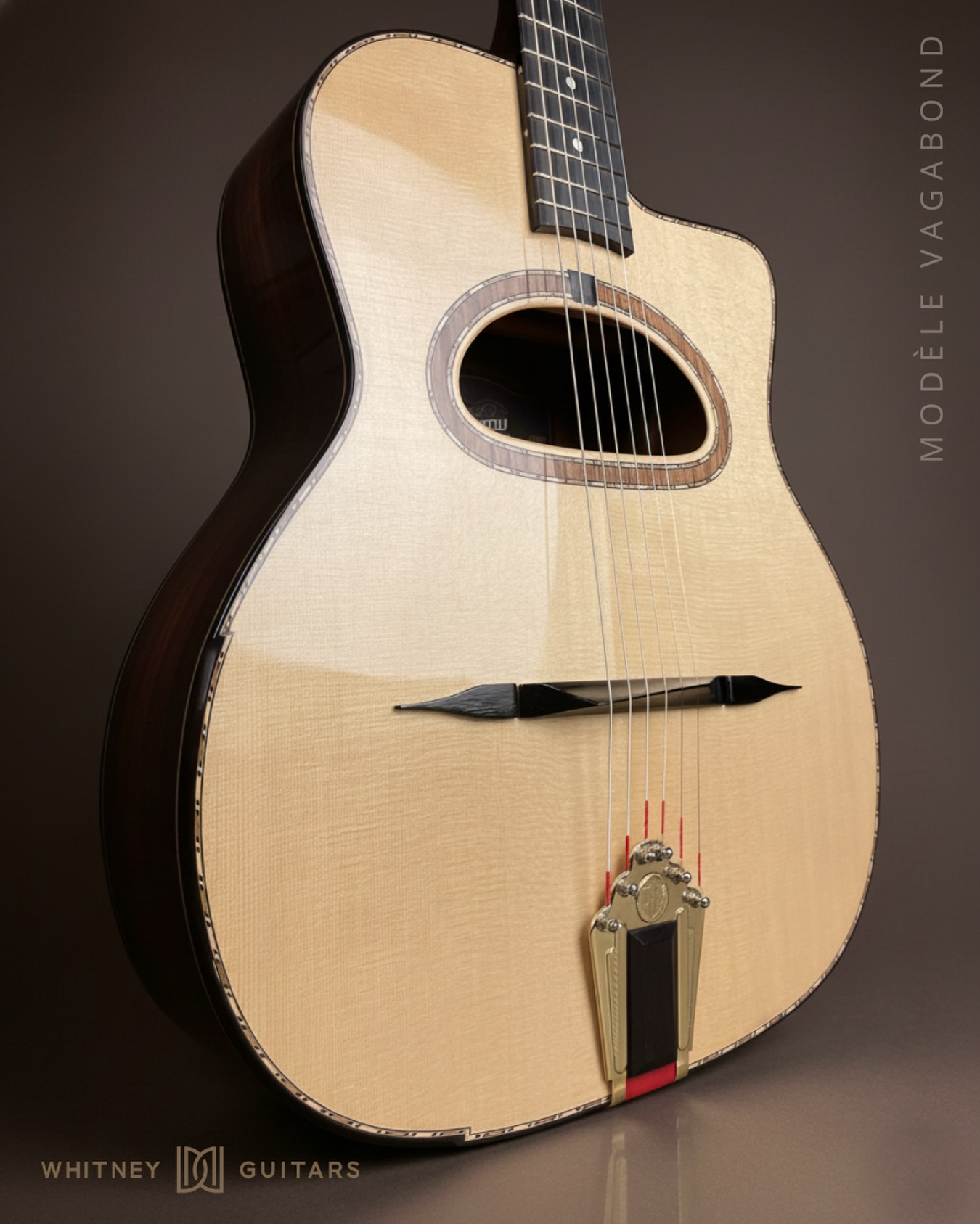 A modern interpretation of the grande bouche tradition — clean lines, a crisp spruce top, and bold hardware accents. The Vagabond model pairs classic Gypsy-style character with refined craftsmanship and a voice built for clarity and dynamic response.
For players who want heritage… without compromise.
Whitney Guitars — Modèle Vagabond