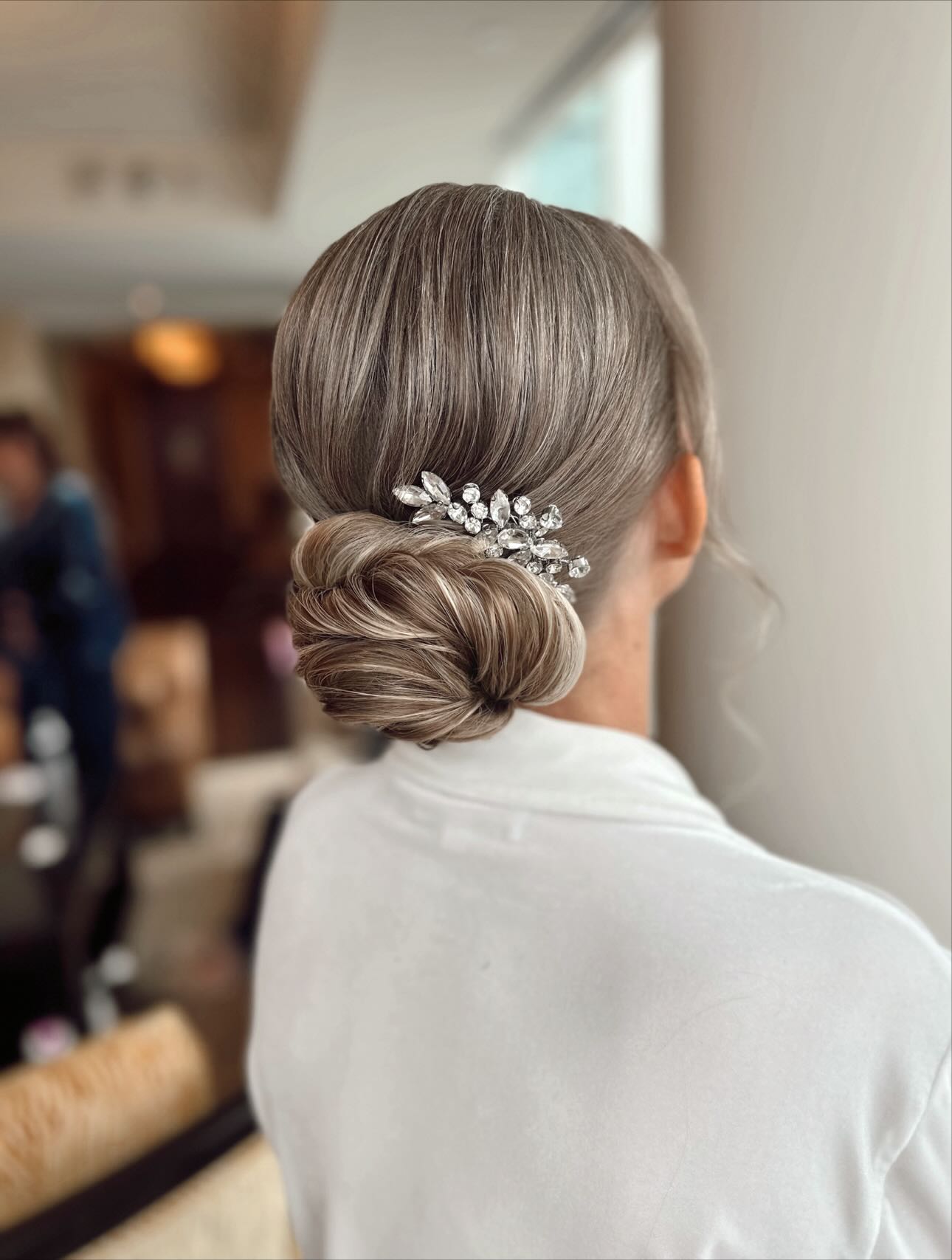 Pamela’s bridal look is such a perfect example of how much creativity, problem-solving, and customization go into every style - far beyond what you see in the final photo.
Swipe to see Pamela’s before → after!
• Pamela has fine, shoulder-length hair, so we started with a blowout using volumizing mousse at the roots to give her that extra lift + texture. (I 🤍 @colorwowhair Bombshell mousse)
• She chose clip-in extensions to add fullness to her bun — but plot twist: they were synthetic, pre-curled extensions from Amazon with about 2 inches of straight ends.
• Synthetic = no heat styling like human hair, which meant I couldn’t prep them like I normally would during her trial. Between the inconsistent curl pattern, pin straight ends, and the plastic-like finish, they brought their own curveballs and were honestly time-consuming to work around. Although she loved her trial look, I’d been brainstorming solutions ever since to perfect her look even with those challenges.
• And if you’re wondering, “Why not just recommend she buy human hair extensions?” - she’s cutting her hair into a short bob after the wedding, so investing in human hair extensions just didn’t make sense for her.
So… cue my mad scientist era. 👩🏻🔬
Thanks to a few synthetic wig-styling tutorials I’d watched, a lightbulb went off. I made a game-time decision: trimmed the straight ends, clipped the pieces to my director’s chair, and very carefully blew them out with a ceramic round brush on medium heat to smooth the uneven texture.
And guess what? IT. WORKED. 🙌🏼
To finish, I skipped smoothing creams (they don’t do much for synthetic fibers - think water-based cream on plastic) and instead used wax pomades + wax sprays to get everything sleek as I built her updo.
I’m so happy with how her final look came together.
It’s the perfect reminder that what you see in the final photo is only a small piece of what happens behind the scenes... the problem-solving, the creativity, and tailoring every choice to our client’s needs, hair, and budget. 🤍✨
Hair & Makeup by Laken Reno
Bridal Hair + Makeup Artist | Serving the DMV, Annapolis & Baltimore