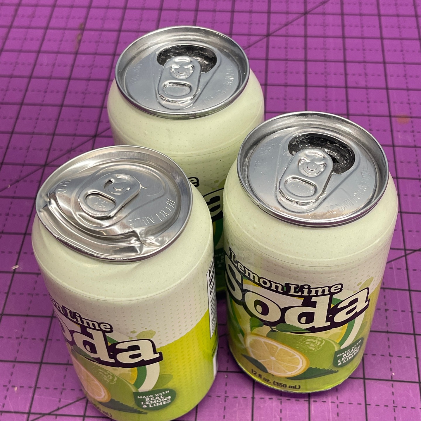 REEL KROME brushed on to prop rubber soda cans.