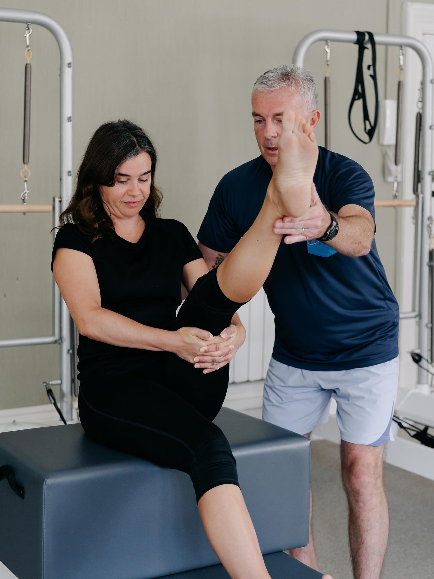Having had back issues from an early age & 2 spinal operations in 2001 & 2003, a Physiotherapist recommended Pilates to Neil.
After a few sessions Neil’s back pain was almost gone, through sitting and standing with better posture and finding everyday tasks and movement so much easier. It worked so well that in 2004 Neil decided to train to become an Pilates teacher.
Neil trained with the Pilates Institute in 2004. Then in 2012, Neil spent four years studying with Karin Locher (2nd generation teacher) from Contrology-Pilates-Method Education to further his knowledge of the method.
When Neil’s not in the studio, he’s out on the golf course, watching the football or walking his dog Mabel.
