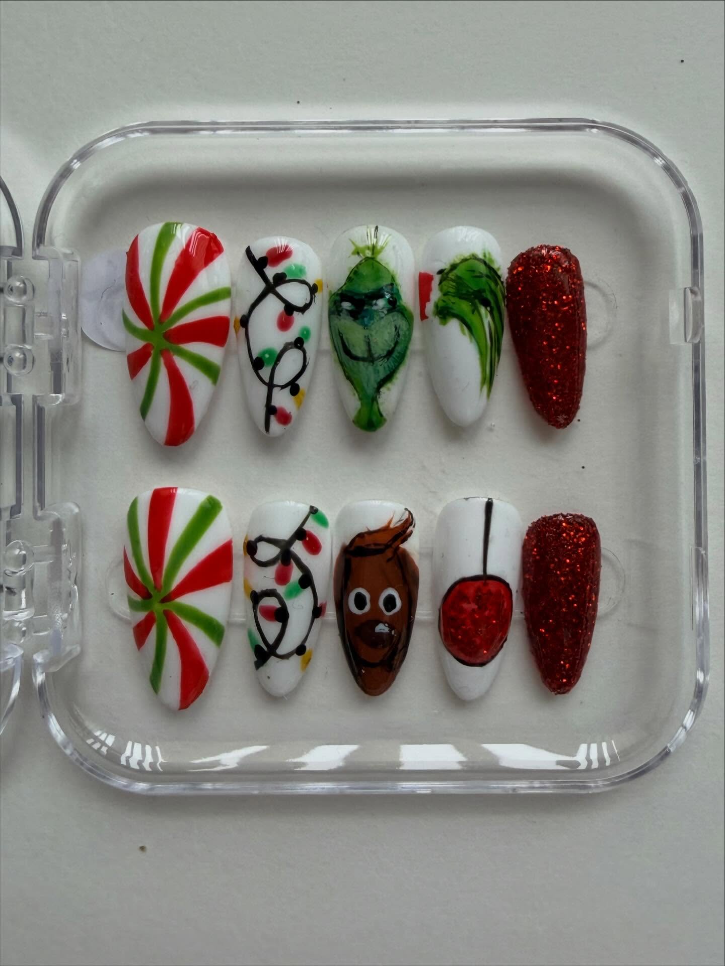 Hand painted Grinch Christmas press on nails with grinch hand and max the dog nail art #nailsnailsnails #nailart #christmasnails #handpaintednails #grinch #nailartist #pressonnails