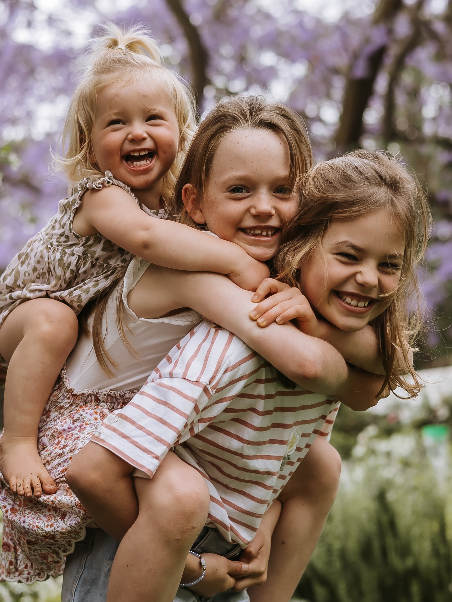 There’s a special kind of magic that happens when a family forgets about the camera and just leans into each other.
Laughter layered on laughter, little arms wrapped tight, Jacaranda season showing off in the background…pure joy.
A morning spent capturing a family who loves loudly and wholeheartedly. My favourite kind of story to tell.🤍