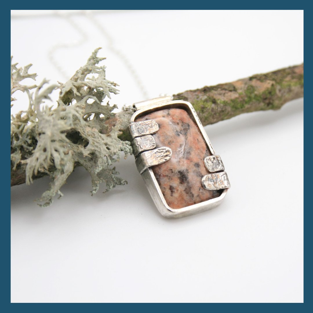 This is the final piece in my cobblestone collection. I have made little silver 'cobblestones' to hold this cobblestone in place and on the back of the pendant is a silver thistle.
Each of the pedants in this collection have a chain with a toggle clasp. I have shaped the toggle to resemble a cobblestone although if you prefer a lobster clasp then I can do that instead.