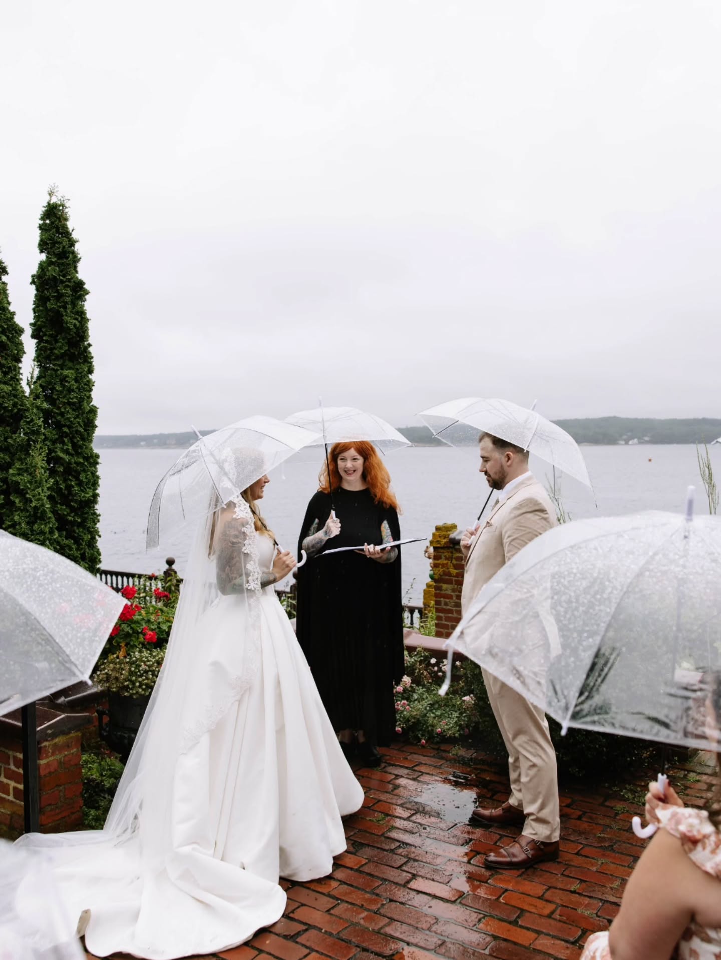 Melanie & Erik traveled from Central Massachusetts to get married at the gorgeous Beauport Sleeper-McCann House in Gloucester, surrounded by their closest family and friends. Even though the skies opened up that afternoon, the vibe was warm and cozy! Armed with umbrellas, we kept going (and rain during a handfasting is extra special - there’s a bit of folklore that says a knot tied in the rain holds truer and longer… because a wet knot is harder to untie!) Their ceremony blended tradition, tenderness, and a touch of Celtic magic. We shared their Love Story, honored the land, included a reading, gave a shout-out to their beloved cats, and wove in a handfasting inspired by their love of fantasy, history, and deep, steady commitment. We even closed with a reading from “The Ballad of the Hobbit,” which felt perfect for them. Surrounded by gardens, the sea, and so many smiling faces, they tied their knot and exchanged rings with hearts wide open. Rain or no rain, the day was radiant… full of love, sweetness, and that joy that comes when two best friends choose each other for life. 🖤
📸 @bygabriellagordon ✨️
#salemweddingwitch #weddingwitch #witchywoman #salemweddingofficiant #quirkywedding #nontraditionalwedding #alternativewedding #handfasting #handfastingceremony #officiant #weddingofficiant #wedding #weddings #weddingceremony #ido #tietheknot