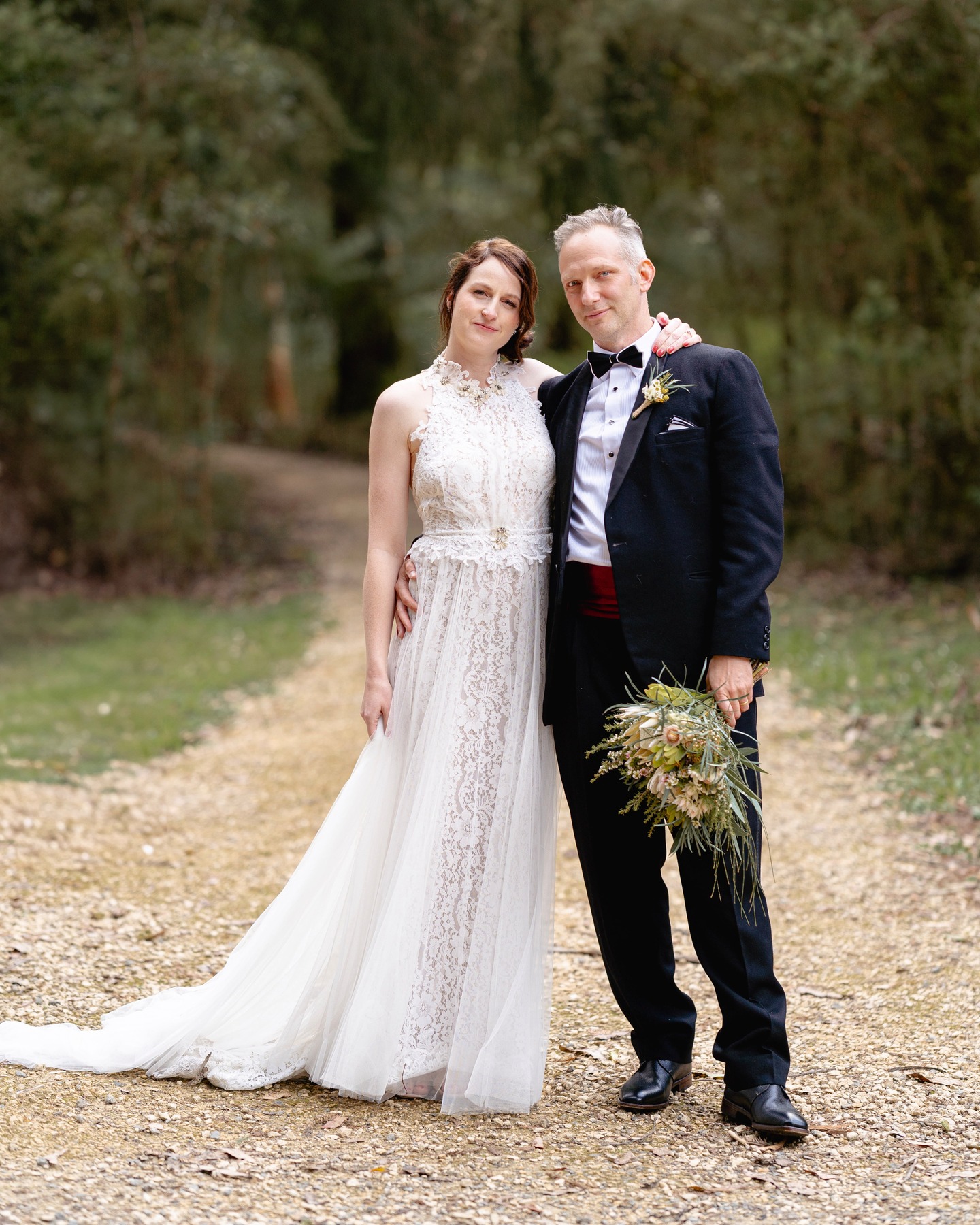 There’s something quietly magical about slipping into the Otways on a mid-week afternoon. The forest feels softer, the light sits lower, and time seems to move at its own gentle pace.
Elisabeth and Jan felt it too. By choosing a mid-week elopement, they found a kind of calm that’s hard to capture on busy weekends. Fewer crowds, more space to breathe, and a sense of privacy that let them stay completely present with each other.
There were no timelines pulling them forward, only birdsong, filtered sun and the steady comfort of being tucked among ancient trees. It gave their ceremony a depth that felt both grounding and free.
For couples who value ease, nature and a moment that feels truly their own, the Otways mid-week offers something rare. A little pocket of quiet where love can unfold naturally.
Photographer: @mikeatchisonphoto