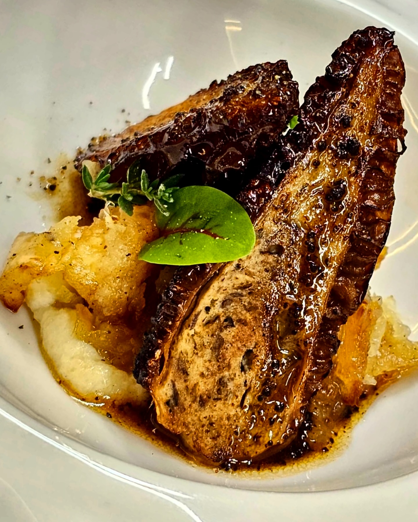 The recollection of a wintry morning walk through woodlands after snowfall, from the flickering comfort of the hearth.
Fallen branches emerge from fresh snow; crunching footsteps releasing the wooded scent of the days of autumn: evoked in a light purée of parsnip with the caramelised bite of roasted parsnips smashed in butter.
We see trees all but stripped of foliage, standing tall protecting only the hardiest of herbs from the harsh frosty breeze, in pan-crisped morels stuffed with the earthy flavours of a truffled farce; snow melting down their bark in rivulets of a sherry enriched truffle jus.
We may not have these wintry landscapes here at home in Malaysia, but around the AG Chef’s Table we do our best to fulfil your hibernal hankerings through each dish on the INVERNO menu.