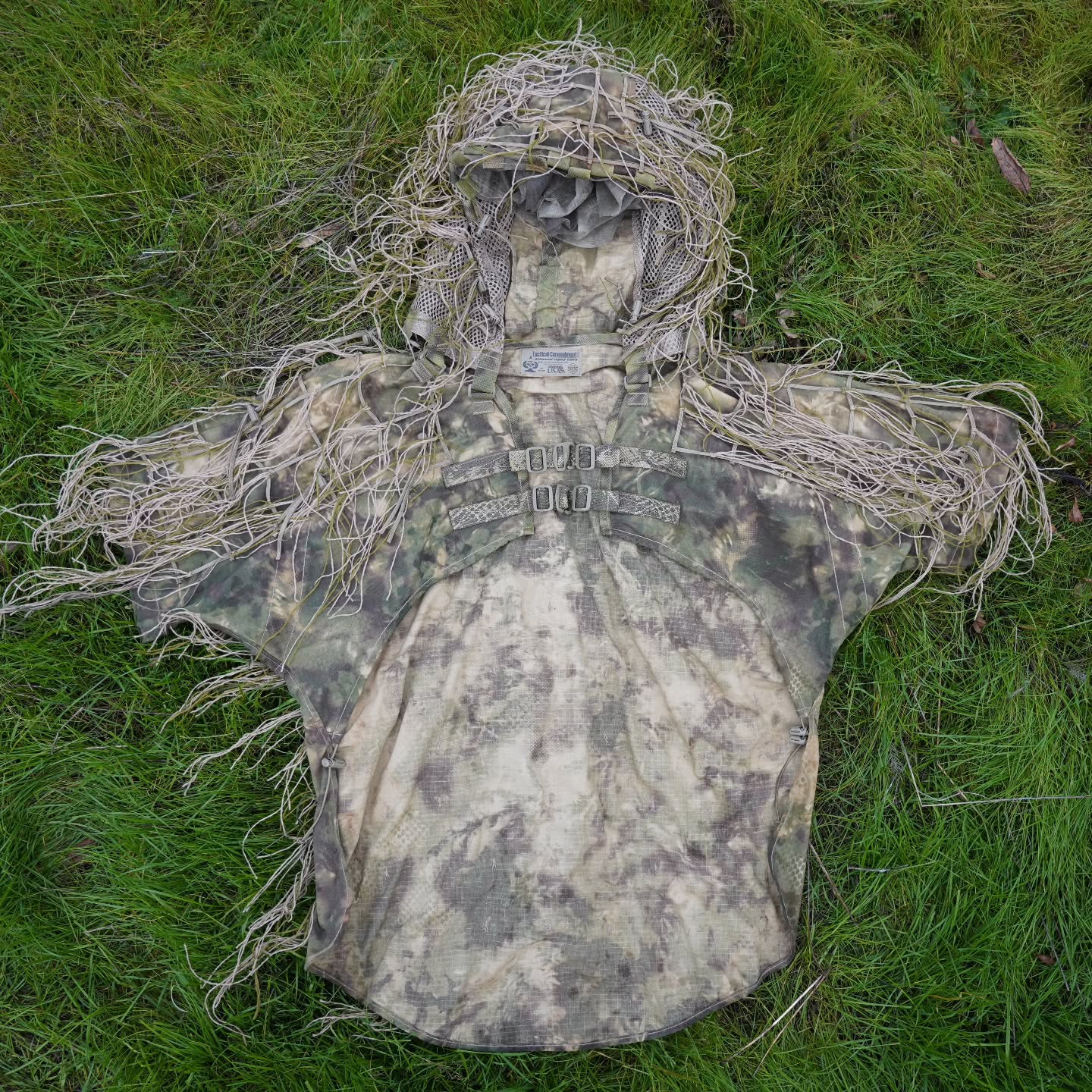 Enhanced Legacy Cobra
Employing Tactical Concealment's 25 years of successful combat-deployed Ghillie manufacturing experience, then listening to the needs of active end users, the Enhanced Legacy Cobra has been designed to provide the most effective personal Vis/nIR signature management solution within an industry-acceptable price point.
This is a full-featured Cobra Hood that includes many of the customized elements often added by the end user:
+ Paracord Grid-Lattice + Veg-Tie-Cords w/Cord Locks hold natural Foliage in place.
+ Hood integrated mosquito mesh Rifle Veil for concealment of a Rifle or observation optics while in an FFP. Rifle Veil features a "rip veil" for rapid removal in an FFP E&E situation.
+ 57/43 NyCo Extreme IHWCU textile produced by Brookwood Rolled Goods exclusively for Sniper Dynamics.
+ Adjustable one-size-fits-most. A multitude of torso & hood tension cords to form a perfect fit with your custom gear loadout.
+ Button-On Long Padded Sleeve upgradable for abrasive low crawl activity.
@tacticalconcealment @brookwoodcompanies
@mmitextiles @murdockwebbingcompany