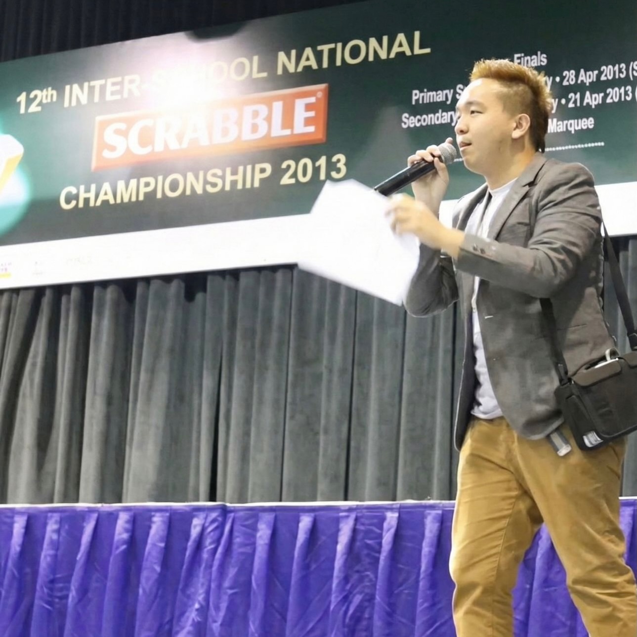 NO FACIAL HAIR THEN!
At first glance, this is just me anchoring this Scrabble tournament as Tournament Director. But that sling bag wasn’t a style choice, it was a medical necessity I needed at that time.
It held a VAC machine (a device for wound therapy). Back then, I literally operated like a rechargeable gadget. I had to plan my entire day, including hosting this event, around the device’s battery life. Damn leychey…
Looking back from 2025, I’m grateful that “living on low battery” is just a memory now. Had to go through multiple surgeries too…