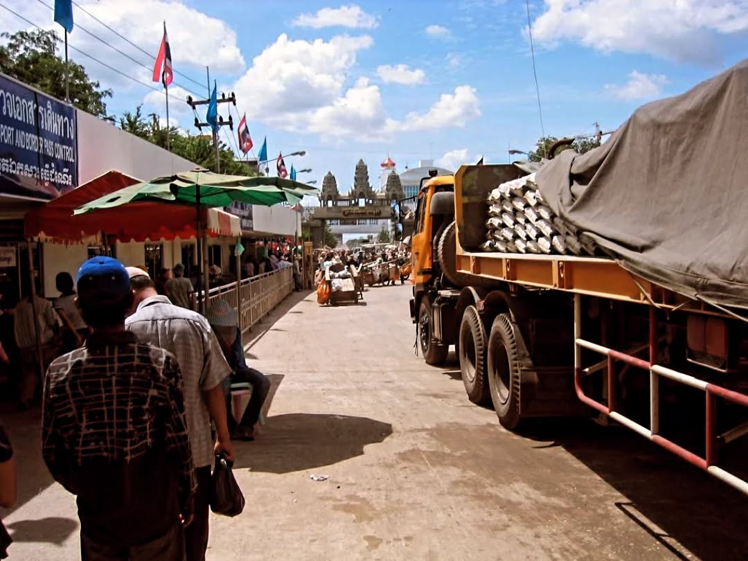 Passage from Travels in the Land of Hunger: A backpacker's earthbound journey from the East to the West 🌏📖
Tuesday, May 18, 2004
... As I walked to the border between the towns of Aranyaprathet, Thailand, and Poipet, Cambodia, I saw a large market on the Thai side with hundreds, maybe thousands, of Cambodians traveling to and from the border. The majority were pulling or pushing large wooden carts either filled with goods (for those going to the Thai market) or empty (for those that came from the market); the strong incentive for these Cambodian traders to sell their wares in Thailand was to earn the stronger Thai baht. These Cambodians were extremely poor; some appeared to be wearing the only clothing they possessed. Children begging for money were quick upon me ... I saw several large, luxurious three or four-story casino buildings on the Cambodian side. It didn't make sense to see so many poor Cambodians hauling their carts into Thailand to make a survival living to see then casinos that exuded wealth. Ricardo explained before we parted ways that since gambling was illegal in Thailand, many Thais crossed the border here to indulge in games of chance.
I saw an older man sitting on the ground of the bridge we had to cross. He had no forearms, and his face had been shredded and scarred from the shrapnel of an exploded landmine, a quick reminder of the five million unexploded ordnance in the country ...
#TravelsInTheLandOfHunger #travelmemoir #memoirwriting #authorlife #indieauthor #bookexcerpt #writersofinstagram #backpacking #backpackinglife #solotravelers #travelphotography #travelreflections #instatravel #cambodia #cambodiatravel #adventuretravel #traveldiaries