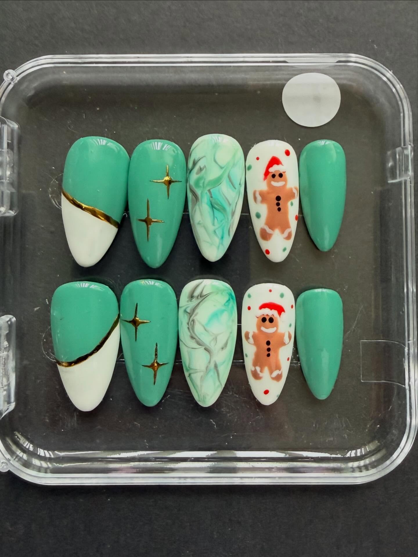 Hand painted Sage and white Christmas press on nails with gingerbread man, marble and gold chrome nail art #nailsnailsnails #nails #christmasnails #handpaintednails #christmas #nailart #naildesign #nailartist
