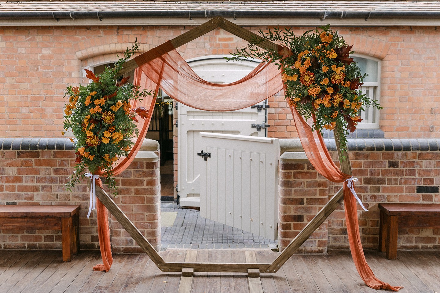🌿AUTUMNAL "I DO'S"🌿
Burnt orange blooms, olive green drapes, and the dreamiest wooden hexagon arch. 🧡
Helena & Henry’s ceremony at The Hall Barns was overflowing with autumnal warmth and personality. The hexagon arch became the perfect focal point. Framing their vows with rich texture, colour, and those stunning florals.
A cosy, romantic setup for two souls ready to say “I do.” ✨
Venue @thehallbarns
Photography @danielburtonphoto
Styling @therusticweddingcompany
Floral bouquets & accessories @bigdaydisplay
Florals on ceremony arch @therusticweddingcompany
Celebrant @bespoke.celebrant.ceremonies
#TheHallBarns #BarnWeddingStyling #AutumnWeddingIdeas #BurntOrangeWedding #OliveGreenWedding #WeddingInspo #HexagonArch #CeremonyStyling #UKWeddings #WeddingDecorIdeas