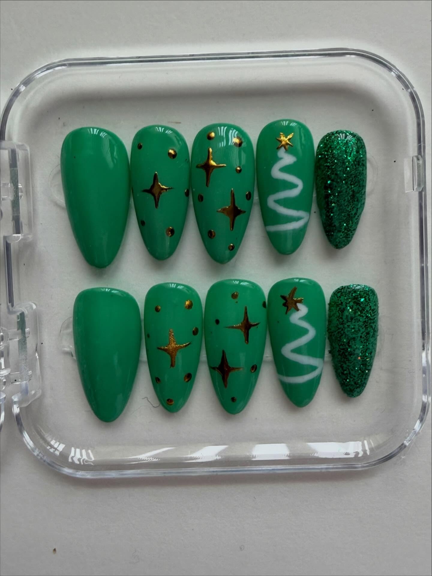 Hand painted green Christmas tree themed press on nails will hold chrome stars #nailsnailsnails #christmasnails #nails #creative