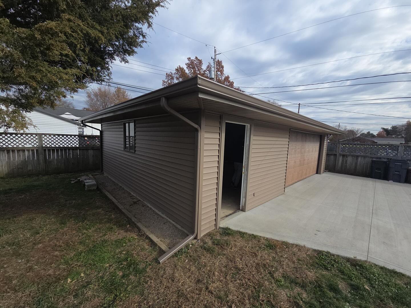 A nice clean update to this detached garage. All new OSB, new siding, soffit, fascia and gutters