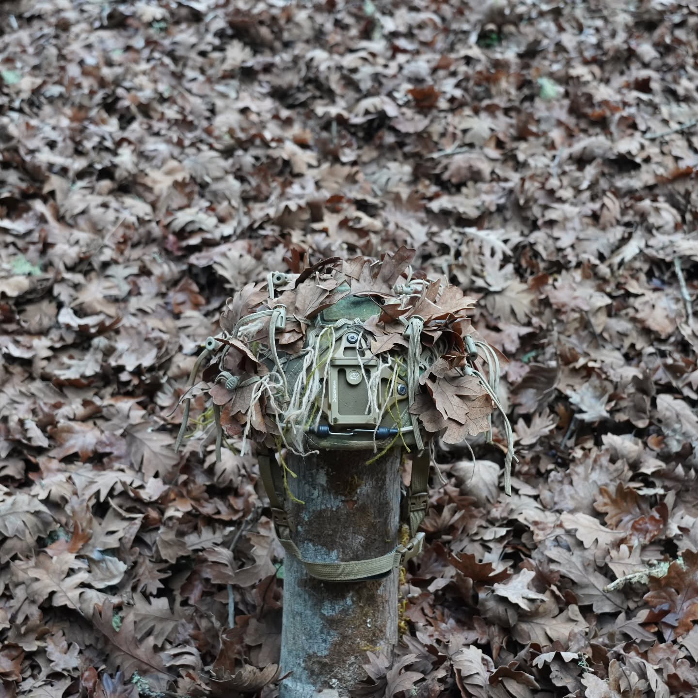 StalkLand Legacy Recce Helmet Cover
Designed to offer the end-user a Ghillie quality concealment solution for their ballistic helmet, the Recce Helmet Cover features:
+ Compatibility with ECH, ACH, IHPS, and Ops-Core Fast high-cut ballistic helmet systems.
+ Para-cord Grid-lattice and qty. 12 Veg-Tie-Cords w/Cord Locks to attach and hold natural foliage in position.
+ Velcro top loop for attachment of IFF capabilities
+ Velcro rear loop section for attachment of Night vision battery packs
+ Allows access to night vision mounts and rail accessories
+ Stretch adjustable fit via Velcro One-Wrap mounting ensures cover remains in place during free fall or rotary-wing high-wind operations.
+57/43 NyCo Extreme IHWCU textile produced by Brookwood Rolled Goods exclusively for Sniper Dynamics.
@tacticalconcealment @mmitextiles @brookwoodcompanies
