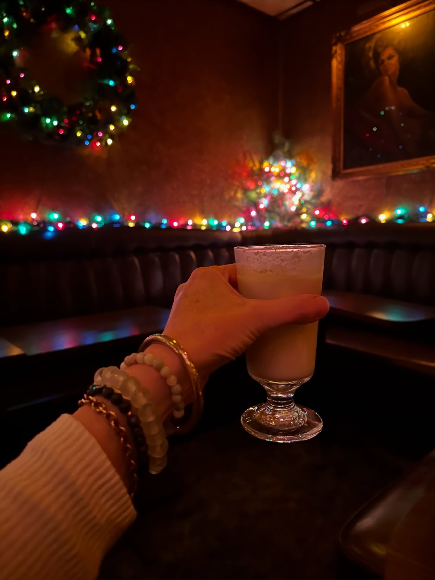 comfort and joy at @bryantslounge 🌲✨
.
#braceletsinthewild holding the best glass of eggnog yule ever taste. 🤍🥃 (see what I did there 😜😘)
.
.
.
.
#alittlesomethingalotoflove #joybombsformoms #cocktailbars #mkemycity #bryantscocktaillounge #festivecocktails #eggnog #foodanddrink #miscarriagesupport