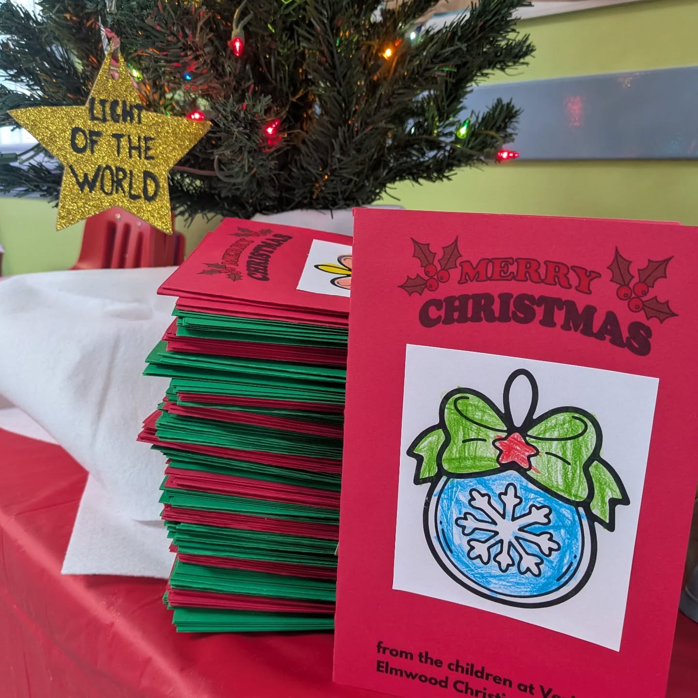 Today our preschoolers will hand deliver 180 handmade Christmas cards to a local nursing home to spread some Christmas cheer! #christmascheer #bethelight #preschoolactivities #givingseason #veritasatelmwood