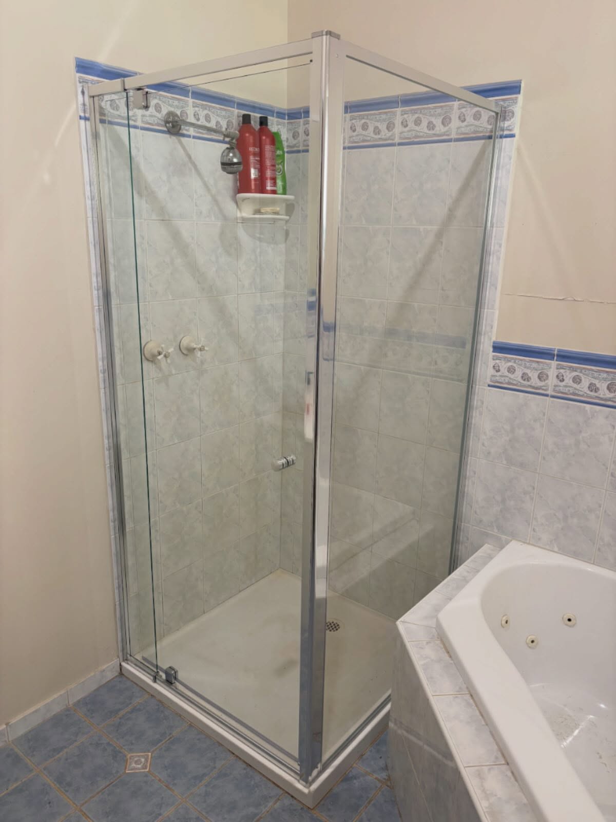 Old white sliding shower screen replaced with this silver semi-framed shower screen in Tynong this morning.