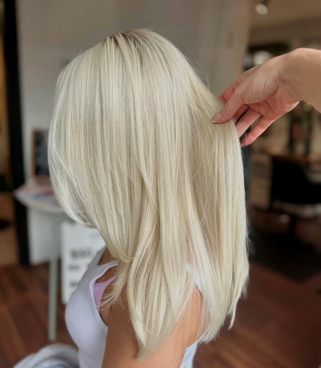 This icy blonde by Seasoned Talent Alycia @alyciahollins has us thinking about the holidays. To achieve this look she bleached and toned with a root tap to soften her grow out.
Is your hair holiday ready? If not, give us a call to get on the books with one of our amazing stylists.
