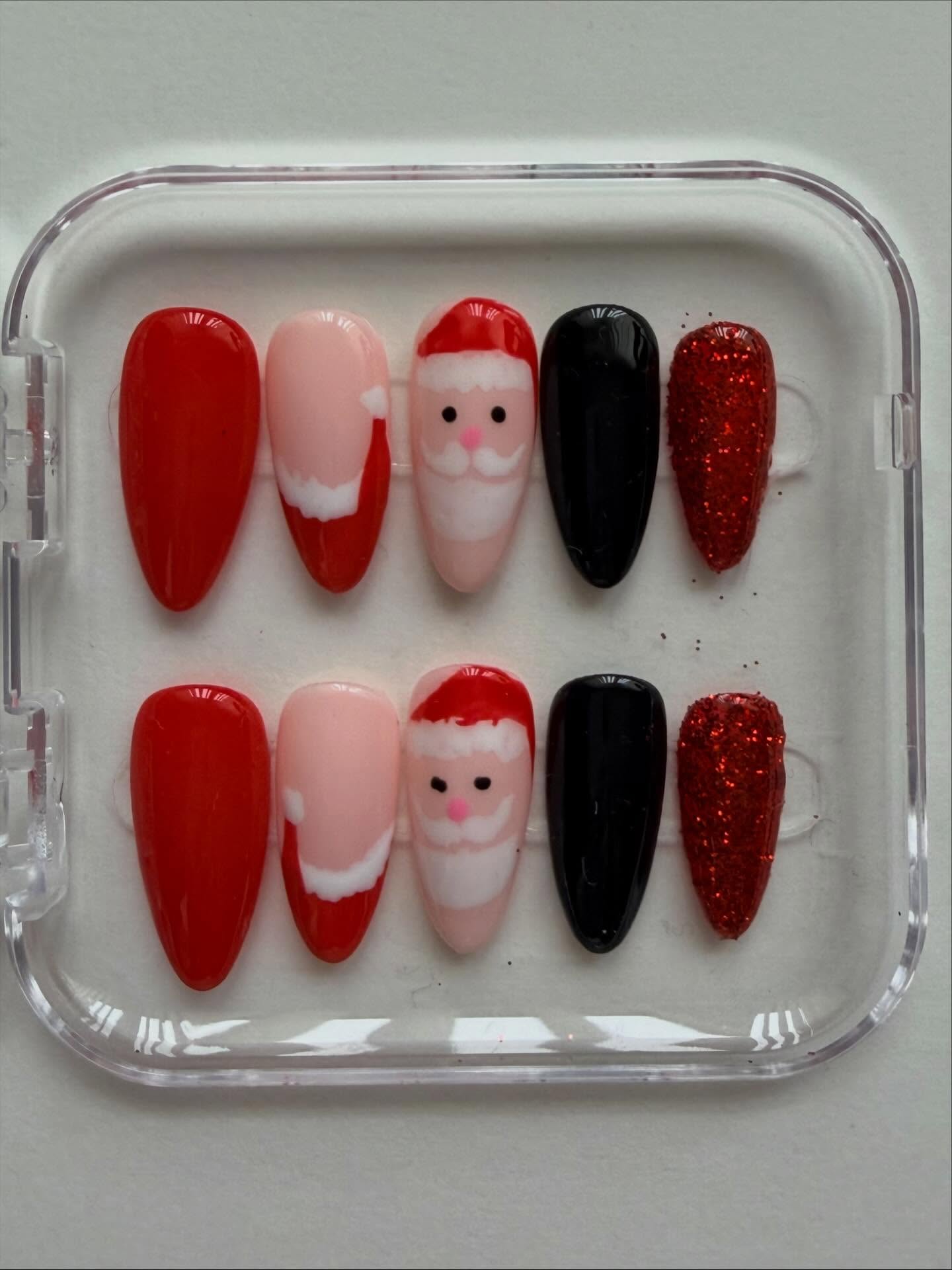 Hand painted Santa themed Christmas press on nails - Christmas nails #nailsnailsnails #nails #christmasnails #nailart #santa #nailartist #christmas #pressonnails