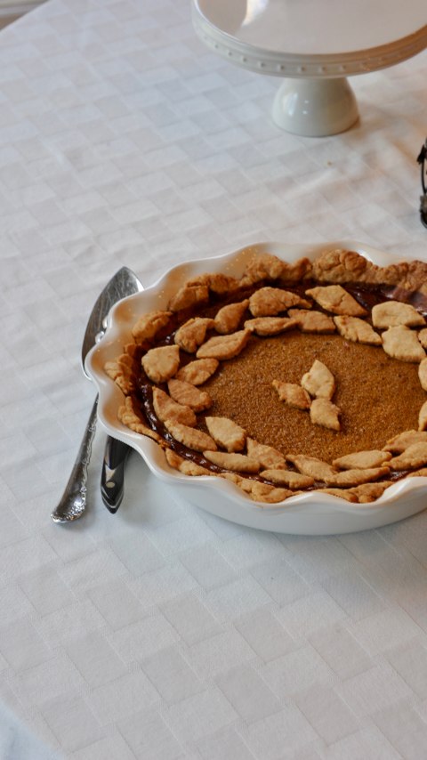 Every year I make pumpkin pie for my family's Thanksgiving. The tradition began many years ago when my grandparents retired to the Georgia Club. Mimi and I would bake together often, and she taught me to make pie crust and pumpkin pie. At first, I thought making the crust was the most fun part. We always make "crust cookies" with the scraps. In the early years, I would help her meticulously make the perfect pie crust and she would finish off the pie. But slowly I began to help her from start to finish. Oftentimes those baking afternoons would end with a sleepover full of good food, games, and a movie with popcorn. Papa would always threaten to steal a slice of pie and ruin our perfect presentation. Many times, the pie would arrive at Thanksgiving dinner with a small slice taken out of it.
I was a junior in college the last time Mimi and I were able to bake a pumpkin pie together. The "memory" popped up in my photos app this weekend. Papa always made sure he took pictures of us while we baked and with our finished product. Every year I bake alone now. I think about all the fun times we shared together and everything she taught me before her dementia took over (she is in memory care now). This year was a little extra emotional for me as I thought about how Thanksgiving and Christmas will never be the same again without Papa. When I close my eyes and think about the holidays, I hear Papa's stories and Mimi's laugh.
So every year I'll continue to bake the pumpkin pie in honor of Mimi. I've swapped recipes and I don't usually bake my own pie crust anymore, but it's a tradition I think I'll keep and share forever. Maybe one day I'll have a little one that can help me bake it each year. The recipe I've been loving lately is from Pioneer Woman:
1 unbaked pie crust
1 can pumpkin puree (I use organic)
1 1/4 c heavy whipping cream
1/2 sugar
1/4 c brow sugar (I use organic coconut sugar)
2 tsp pumpkin pie spice
1 tsp vanilla extract (I use a bourbon vanilla)
1/2 tsp sea salt
2 large eggs plus 1 yolk
Serve with homemade whipped cream!
Instructions posted on my blog on my website (I'll link in stories)
Happy Thanksgiving Cooking!