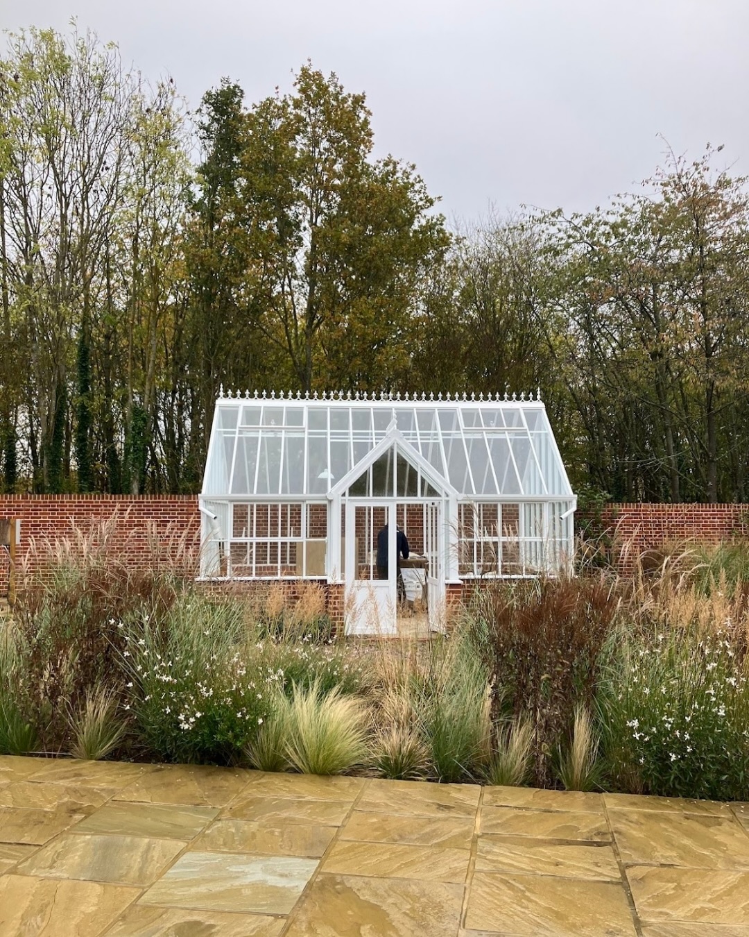 Early November colour in this Traditional Essex Country Garden!
Whilst this project is still under construction, we have been able to get planting around the house.
A beautiful @hartley_botanic glasshouse is set against an existing red brick wall, surrounded by fragrant herbs. A new Yorkstone terrace looks out onto a gravel garden surrounded by ornamental grasses and tall structural flowering perennials.
Species here include: Calamagrostis brachytricha, Carex testacea ‘Prairie Fire’, Deschampsia cespitosa, Miscanthus sinensis ‘Kleine silberspinne’, Oenothera lindheimeri ‘Whirling Butterflies’, Stipa tenuissima, Verbena hastata ‘Blue Spires’.
This area has flourished since being planted in April, and now we can see how beautiful the planting looks even after the flowers have gone over.
We’re really excited to see this garden develop further, and will be back with updates next year!
⸻
ABOUT: Joe Perkins Design is a multi-award-winning landscape design consultancy, creating innovative outdoor spaces that celebrate the environment, wildlife, and biodiversity. Working across the UK and internationally, we partner with clients who share our passion for sustainable and visionary design. Discover more about our work at: www.joeperkinsdesign.com