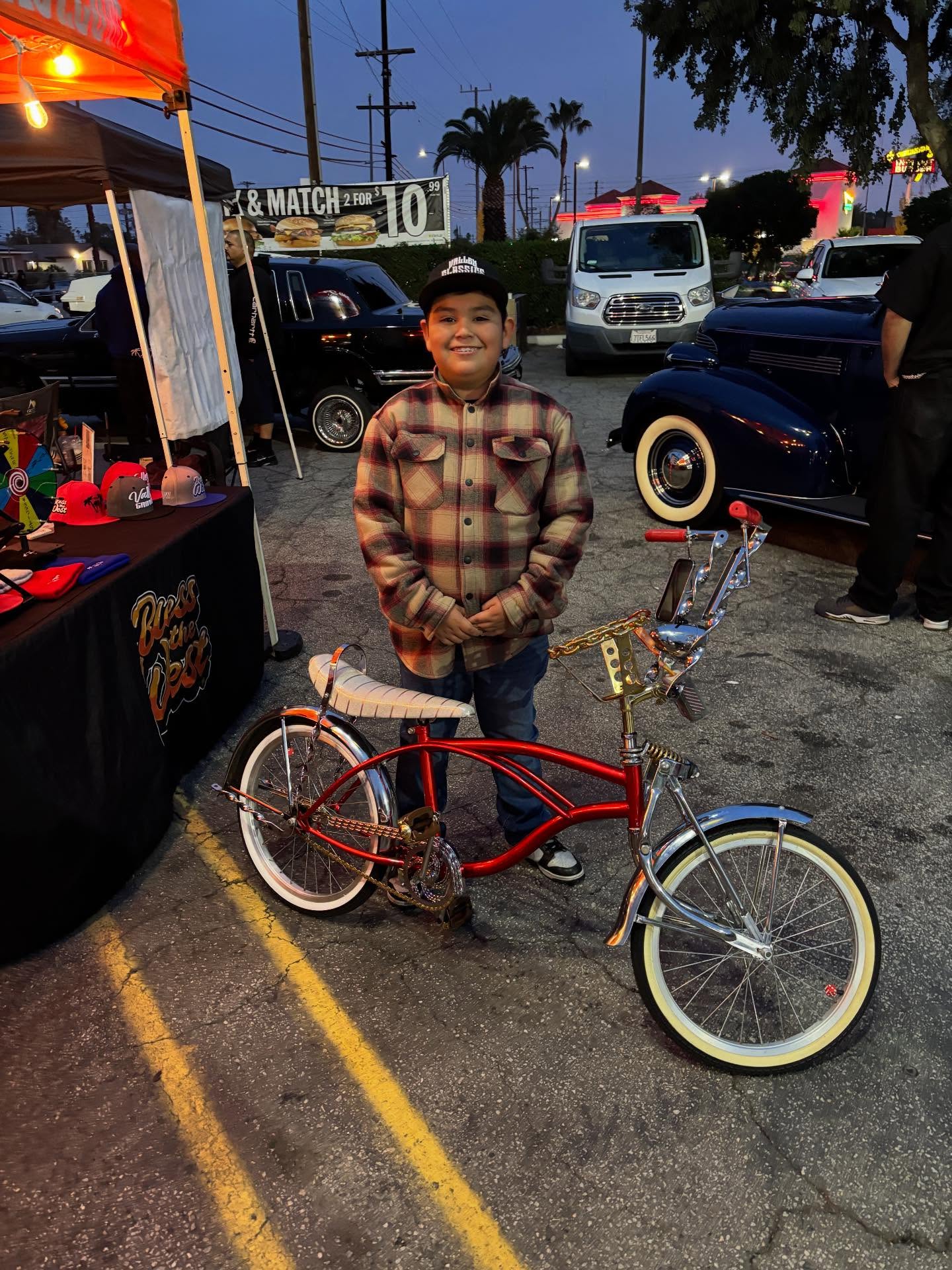 This young man stopped by the booth to grab some Bless the West stickers! Had to get a pic of him and his clean ride!
Keeping it West Coast!
