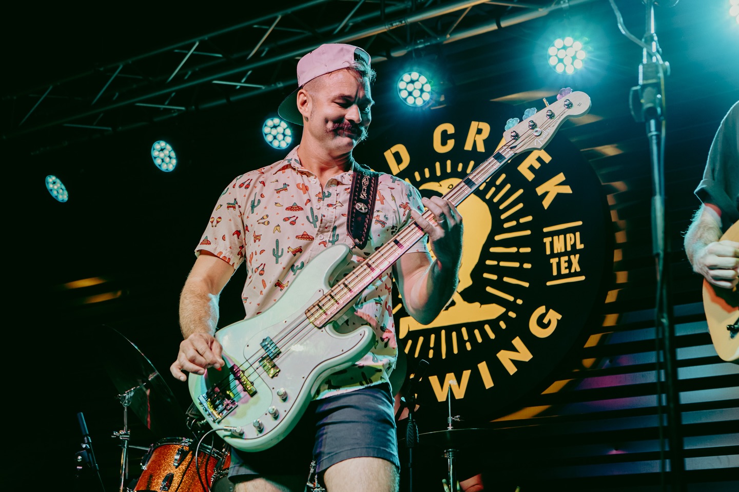 Wish a happy birthday to the best bass player around, Travis Arnold! Here’s to another year of the shortest shorts, cold Miller Lite, and the best bass lines in Texas!