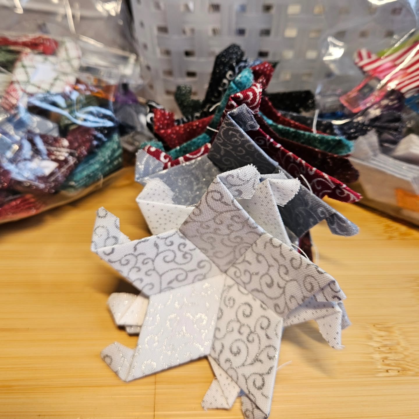 So many pretty colors and sparklies in progress!
.
#ornamentsasgifts #giftshopping #smallbusiness #fiberartist #eppornaments #englishpaperpiecing #handsewnornaments #horsenroundfiberstudio #eppquilting #epp #handquilting #fiberartisan #christmasfabric #giftideas #moravianstar #moravianstarornament #2025holidayartisanfair #buckleywa #bellevuewa #monroewa