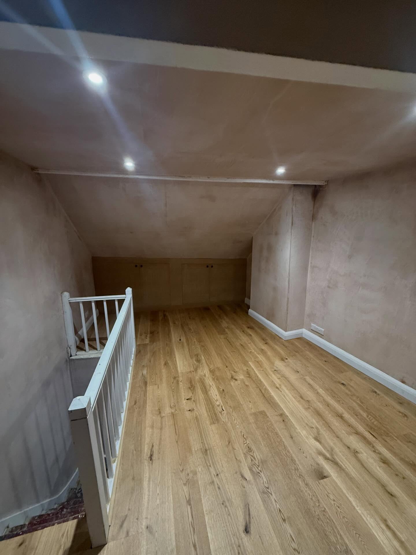 Before & after - small attic renovation, we took out an old eaves wall to open to a now huge attic space, we fit engineered oak flooring and custom MDF cupboards built back into the eaves