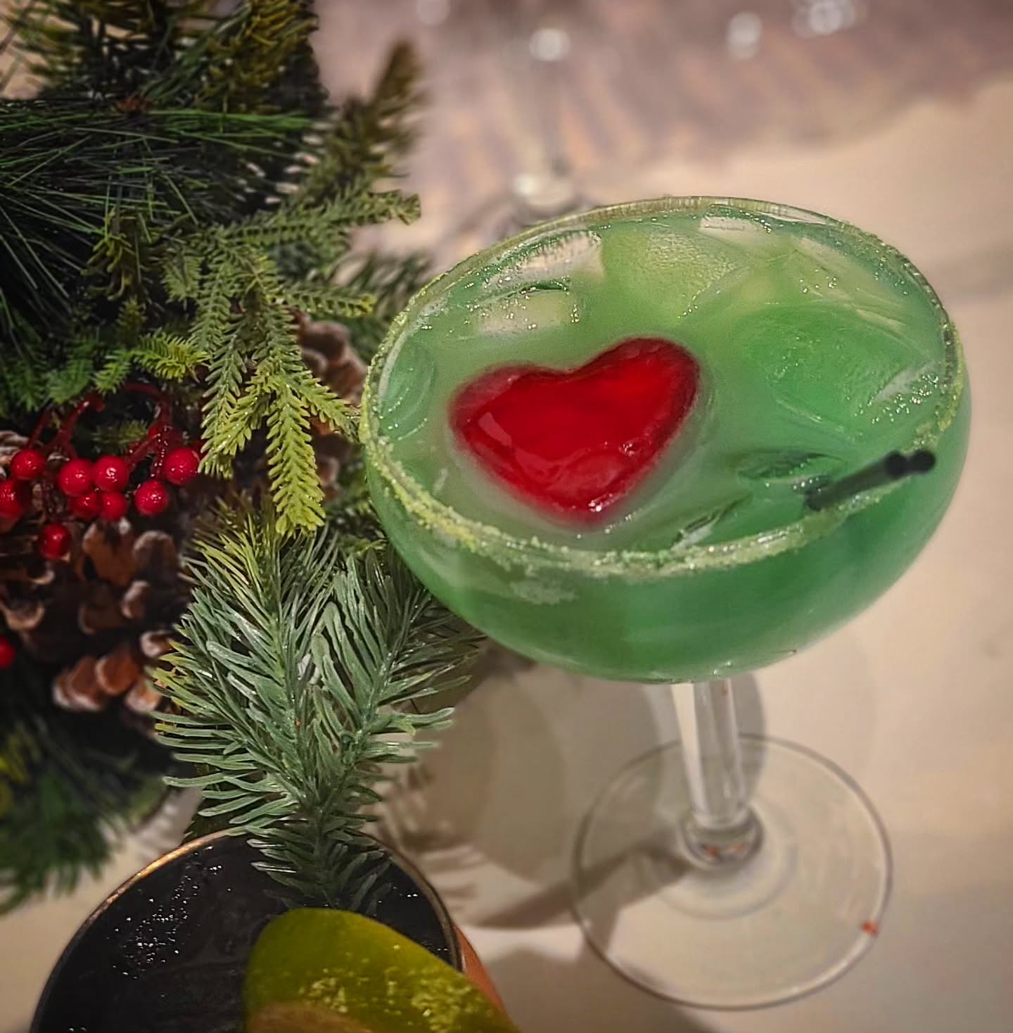Grinch Glow. Tequila, Orange Juice, Blue Curacao, ❤️ ice cube