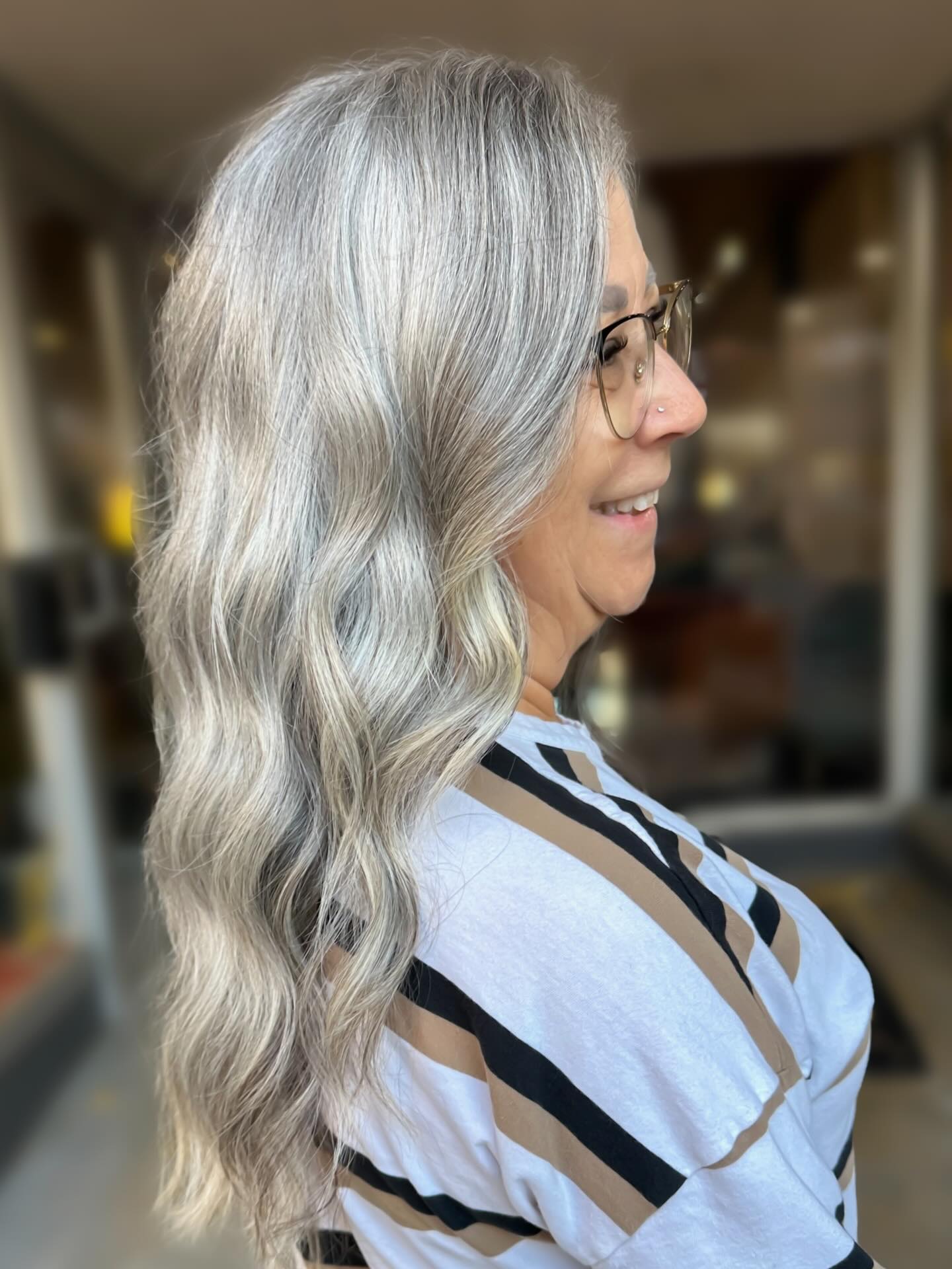 Going grey, the intentional way 🩶
Back in April 2023, we started her transition to embrace her natural silver.
By October 2023, after our second session, her color journey was complete. ✔️
Recently she came in and we did a simple haircut and snipped off the very last hint of old color — the leftover warmth and yellow that had been hanging on.
Now her silver is fully hers… healthy, dimensional, and absolutely stunning.
✨ This is what patience, trust, and embracing your natural beauty looks like.
Silver Fox Complete 🩶
.
.
.
Located inside Downtown Roots Salon
📍 321 Clinton St Defiance
💻 BeautiByMandi.com