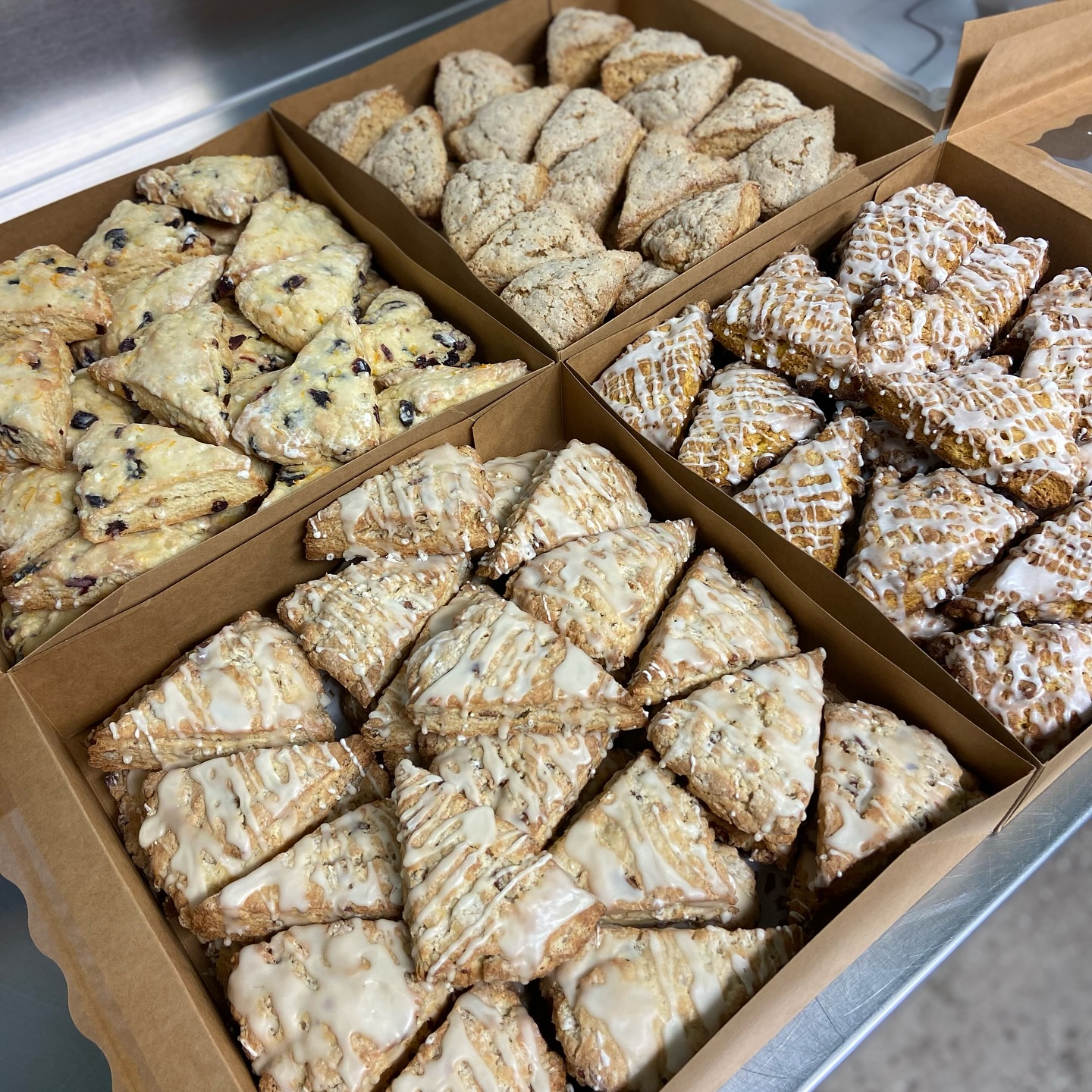 Company party coming up quick? Tired of the same box of munchkins and stale donuts? We got you covered!
Order mini scones by the dozen, or try our holiday scone sampler (16 count) as well as our assorted cookie platter (30 count). Be the reason everyone’s asking “who brought those delicious treats?”
Give us atleast 3 days notice and we will have your order prepped, baked, packaged, and ready to eat! Order yours today!
