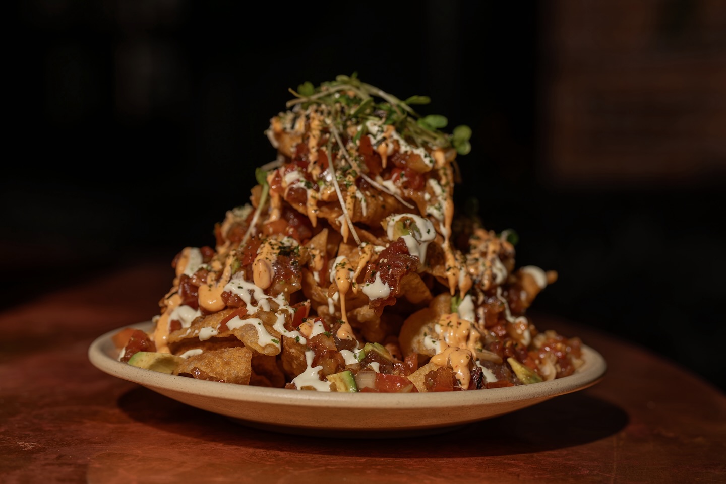 fresh, fun, and full of flavor 🌊🥑our tuna poke nachos come loaded with sweet onions, spicy....