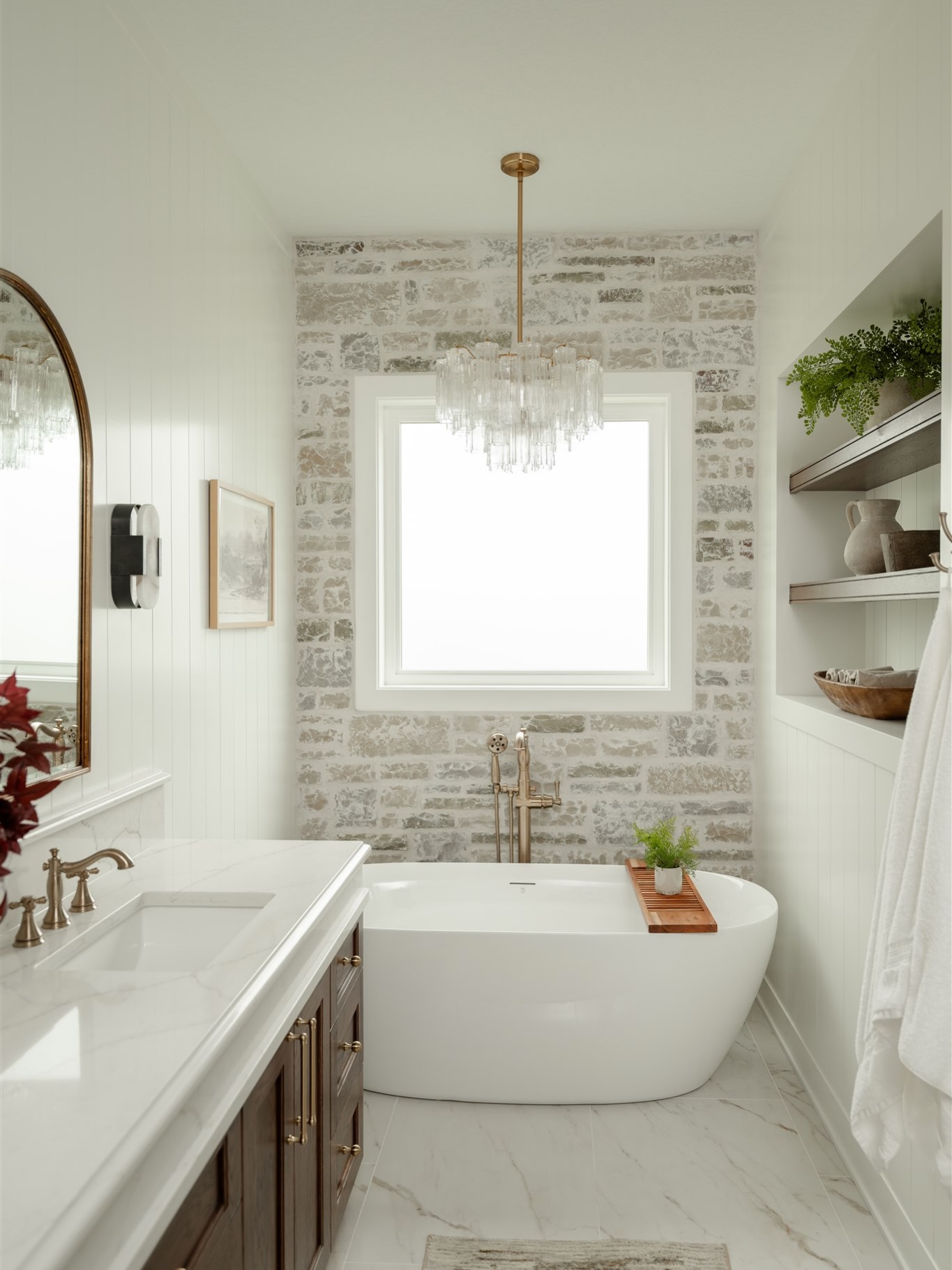 They say lighting and plumbing are the jewelry of a home, and this space proves it. The hand picked stone and shiplap to set the foundation specifically for this room, and the thick quartz wrap adds the perfect balance of softness and strength. Every element was chosen to feel timeless, layered, and lived in.