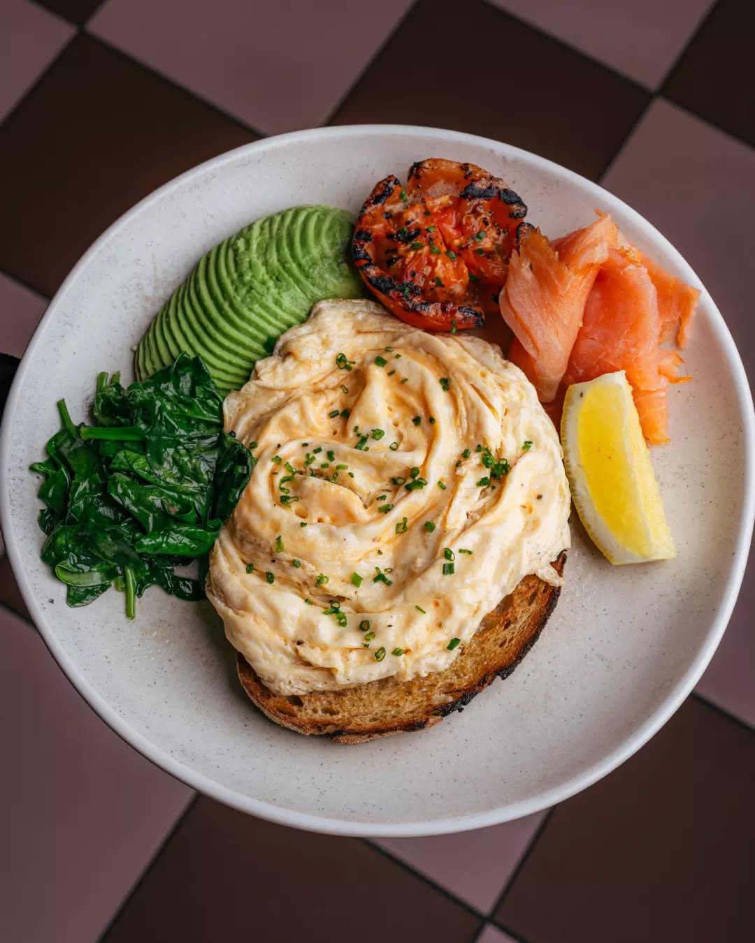 Breakfast your way. Pick your favourites — eggs, avo, smoked salmon, greens, grilled tomato and more — and build your perfect plate.