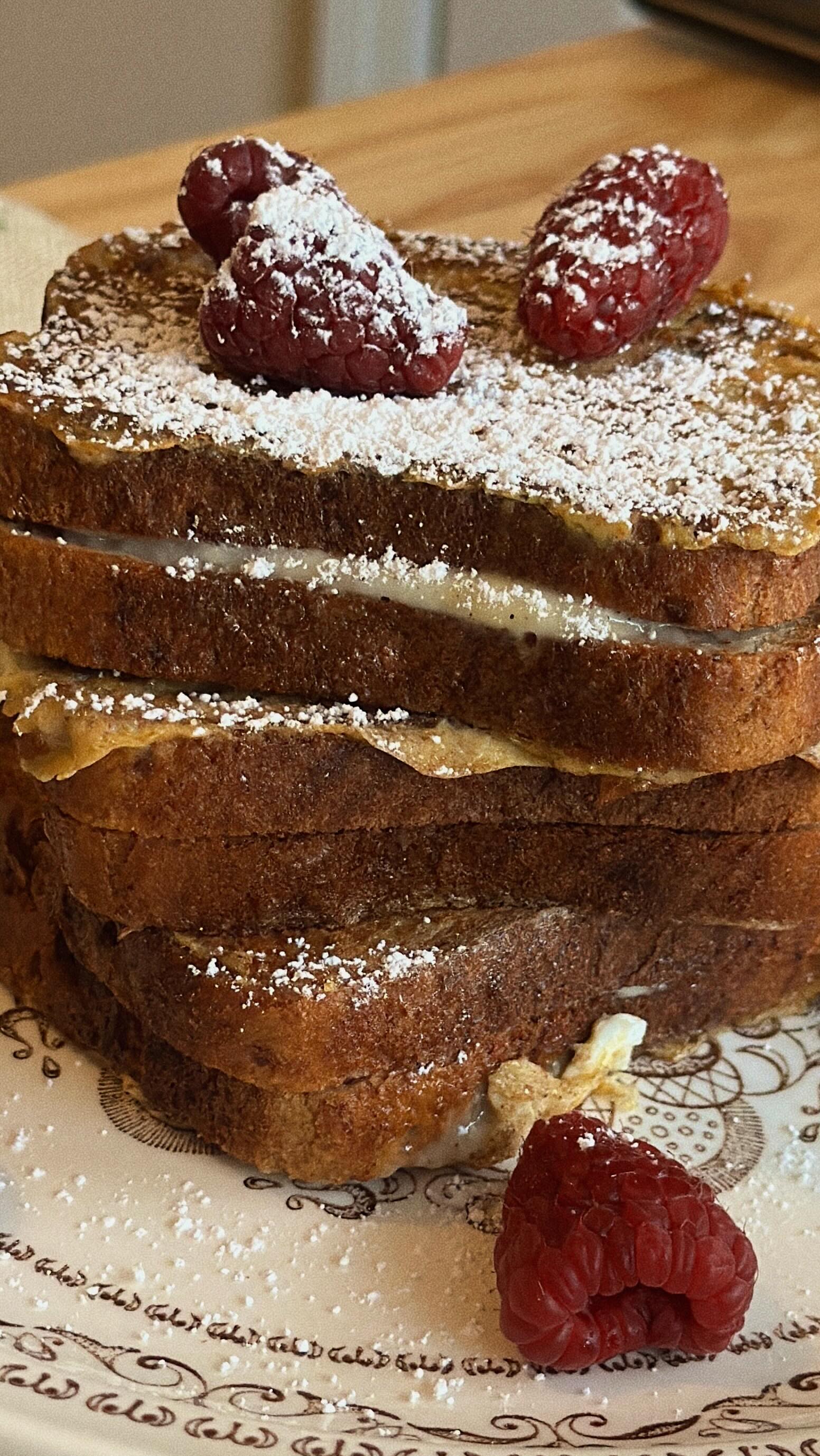 Make breakfast the star of the show this holiday season with Gluten Free Eggnog Stuffed French Toast made with Canyon Bakehouse Cinnamon Raisin Bread!
For the Toast:
8 slices Canyon Bakehouse Cinnamon Raisin Bread
2 tbsp Butter
For the Filling:
4oz Cream Cheese
1 cup Powdered Sugar
2 tbsp Egg Nog
¼ tsp Nutmeg
1 tsp Vanilla Bean Paste
Dash of sea salt
For the Dredge:
2 Eggs
½ cup Eggnog
¼ tsp Nutmeg
1 tsp Cinnamon
1. Beat cream cheese, powdered sugar, eggnog, nutmeg, vanilla, and a pinch of salt until smooth.
2. Spread the filling onto 4 slices of Canyon Bakehouse cinnamon raisin bread and top with the remaining 4 slices to make sandwiches.
3. Whisk together eggs, eggnog, nutmeg, and cinnamon for the dredge.
4. Dip each stuffed sandwich into the dredge, coating both sides.
5. Melt 2 tbsp butter in a skillet over medium heat and cook each sandwich until golden and the filling is warm and melty.
6. Slice, dust with powdered sugar, and enjoy!
#stuffedfrenchtoast #canyonbakehouse #glutenfreerecipes