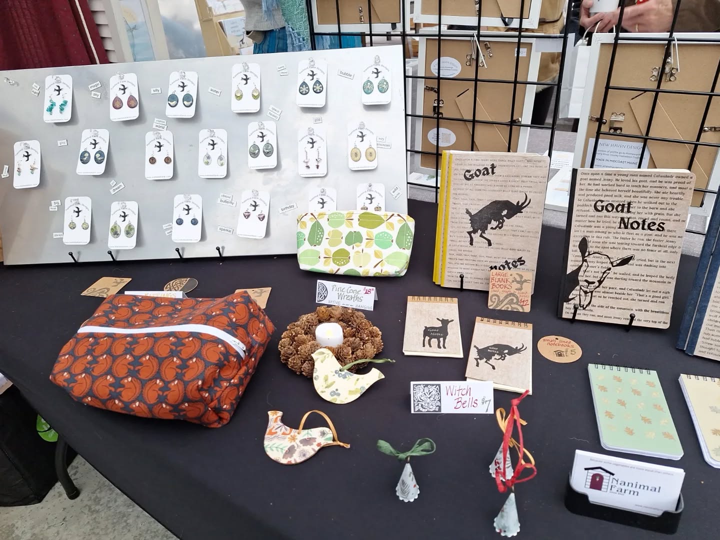 What a great weekend -- @guiniridge Christmas Market on Saturday, and @pumpkinvinefamilyfarm Yule Goat celebration on Sunday! I'm so enjoying seeing new & familiar faces and meeting new friends, not to mention seeing so many smiles and festive outfits! Feeling grateful that my jewlery, ornaments, bags, & blank books are helping people check gifts & holiday decorations off their lists. 💕🎁 Witch Bells are a particular hit, and Goat Notes now have quite the cult following! 🐐 📓 Back to Guini Ridge the next 2 Saturdays, 9-2.
.
.
.
.
.
.
#holidaymarketmaine #locallymadegifts #handmadeearrings❤️ #decoupageornaments #witchbells #birdornaments #rocklandmainearts #buylocalthischristmas #maineartisans #thingstodoinmidcoastmaine #handmadegifts🎁 #zipperpouches #blankbooks #octopuslover #crittercrafts