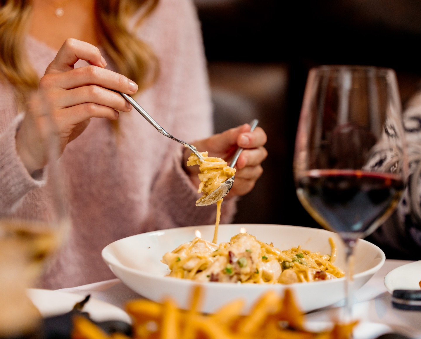 A slow swirl of handcrafted pasta, a deliberate pour of wine, and the steady promise of a night meant to be savored.
