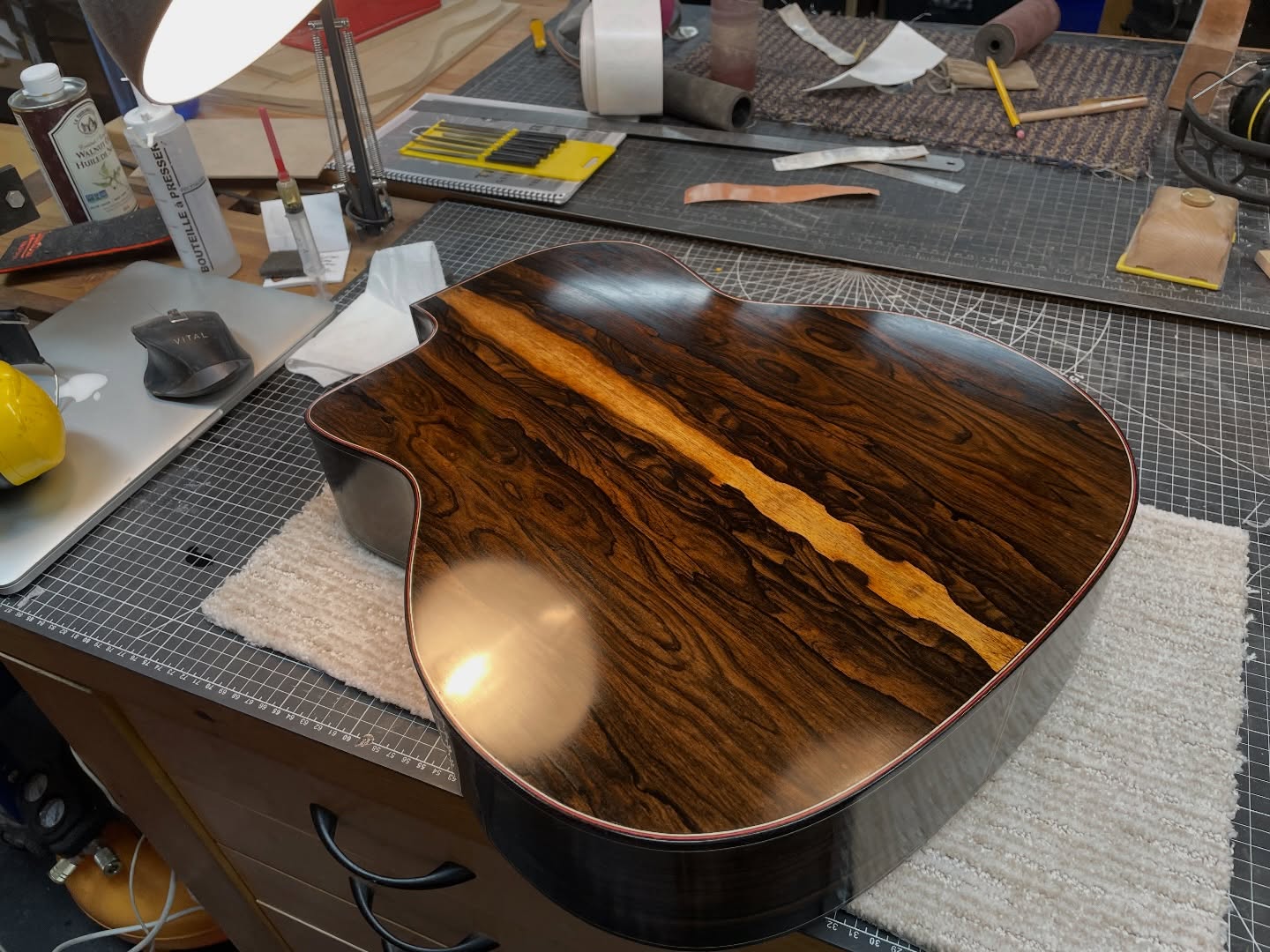 Swirly, swirly. Here is the backplate of Mike’s Gypsy guitar during the French polishing stages. Check out that beautiful ziricote backplate!
We have several projects on the go as Mike moves into his final week of his 6-month course.
More photos to come!