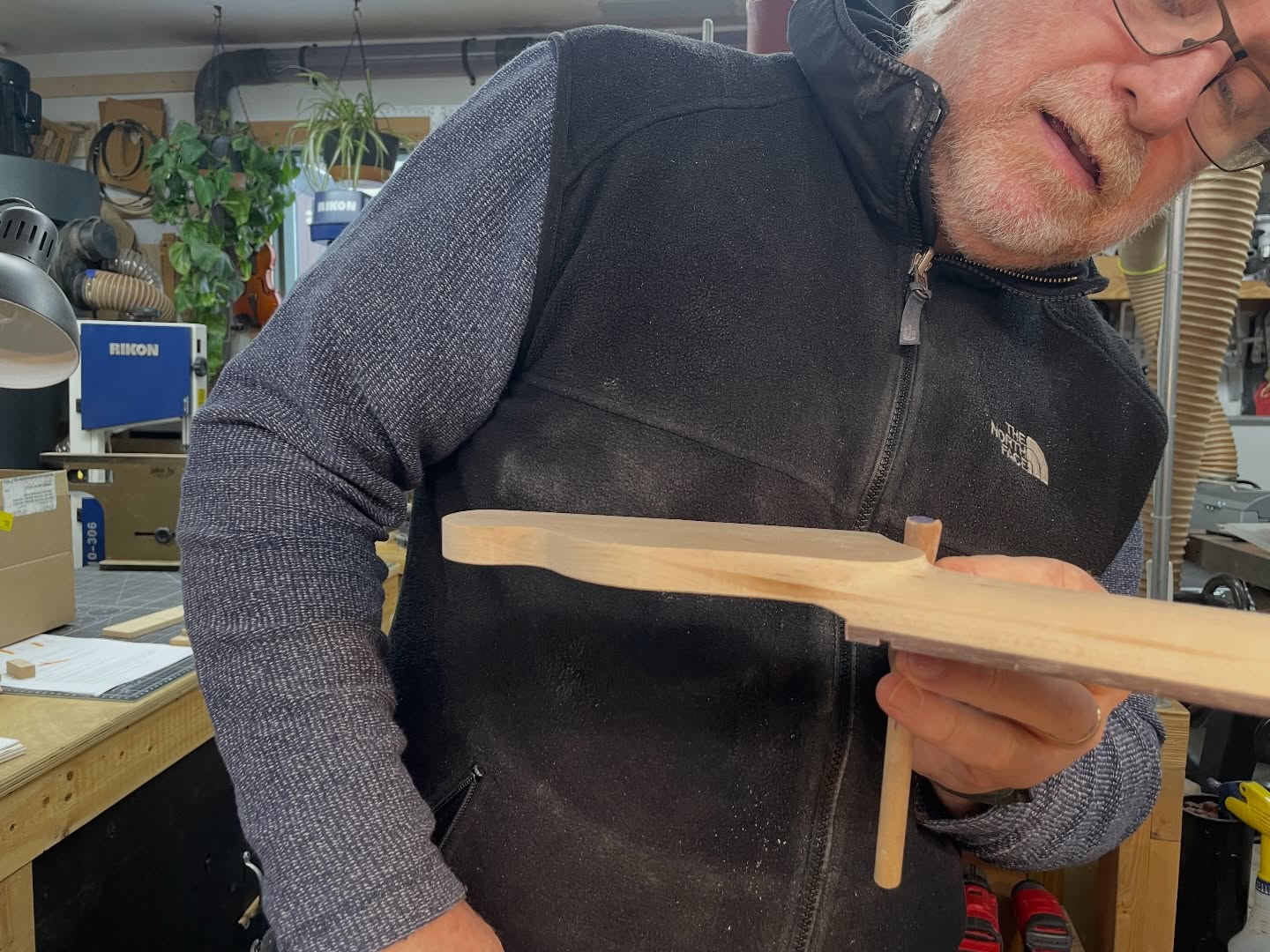 Here’s. Mike, carefully shaping the volute on his Tele build.