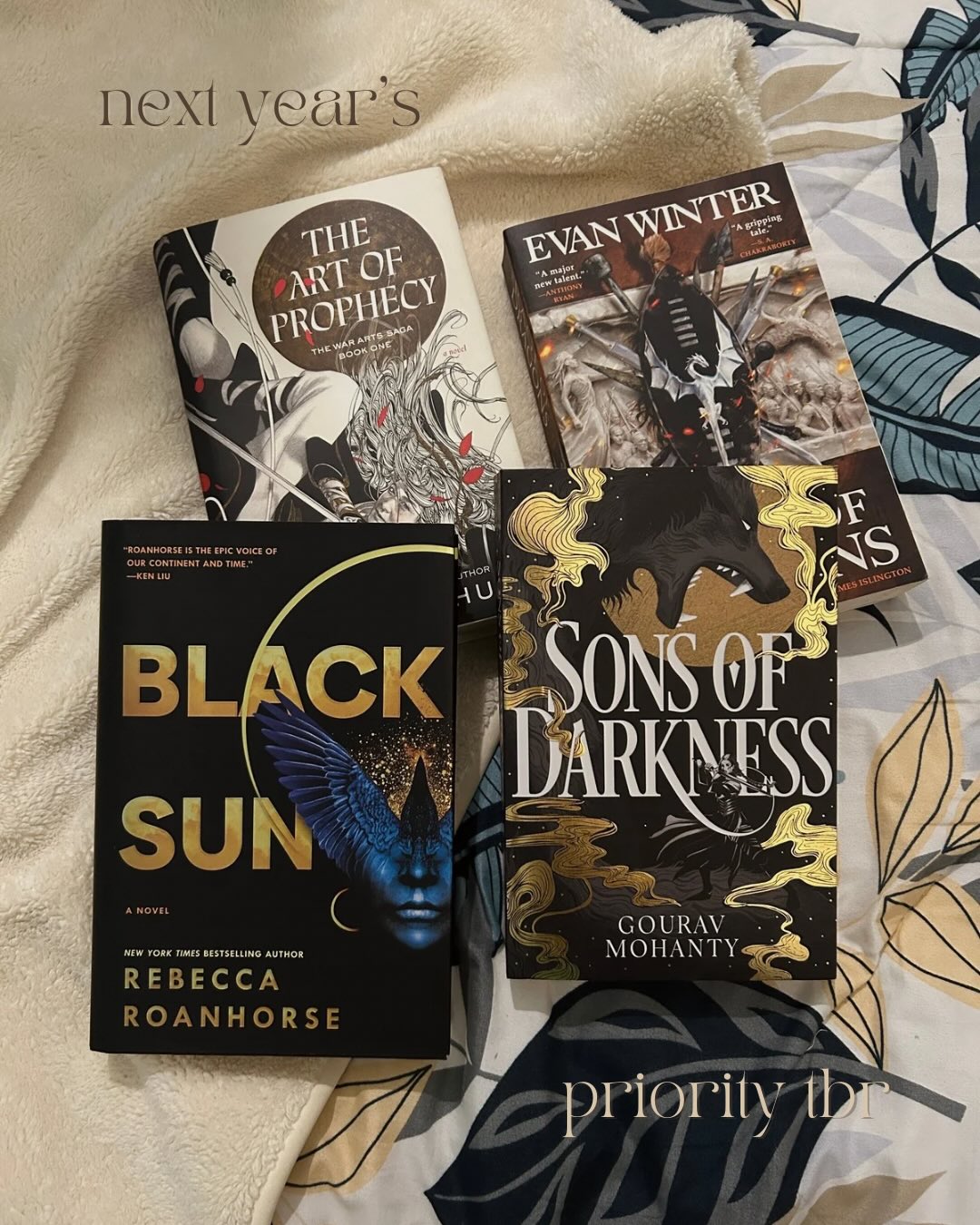 26 books for 2026 — my priority tbr
the reading energy i want to being into 2026, ft. the big books i wanted to read this year. i’m leaving in a few days and it would be painful to bring. i do want to get through their respective series sooner rather than later. i focused on already released books bc we’ll be here all day if i included new releases… except for The Last Contract of Isako, i’m sorry for the person i will be once i get my hands on a copy. Fonda Lee has me in a chokehold.
something about seeing all of these books together makes me excited. in the meantime, i’m continuing Realm of the Elderlings (book 1’s ending was wild) and keeping an eye out for Dandelion Dynasty — i’ve been waiting until the new covers are available where i am or if i find them while traveling.
books pictured:
the art of prophecy by wesley chu
the rage of dragons by evan winter
black sun by rebecca roanhorse
sons of darkness by gourav mohanty