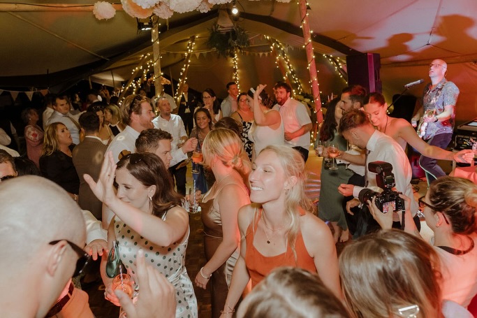 A tipi, a dance floor overflowing with energy, and the bride & groom leading the charge — that’s our kind of party!
This crowd did. not. stop.
@jdoorphotography capturing the vibes 😍
#PartyBand #WeddingVibes #UKWeddingBand #TipiWedding #TheMadhattersTeaPartyBand