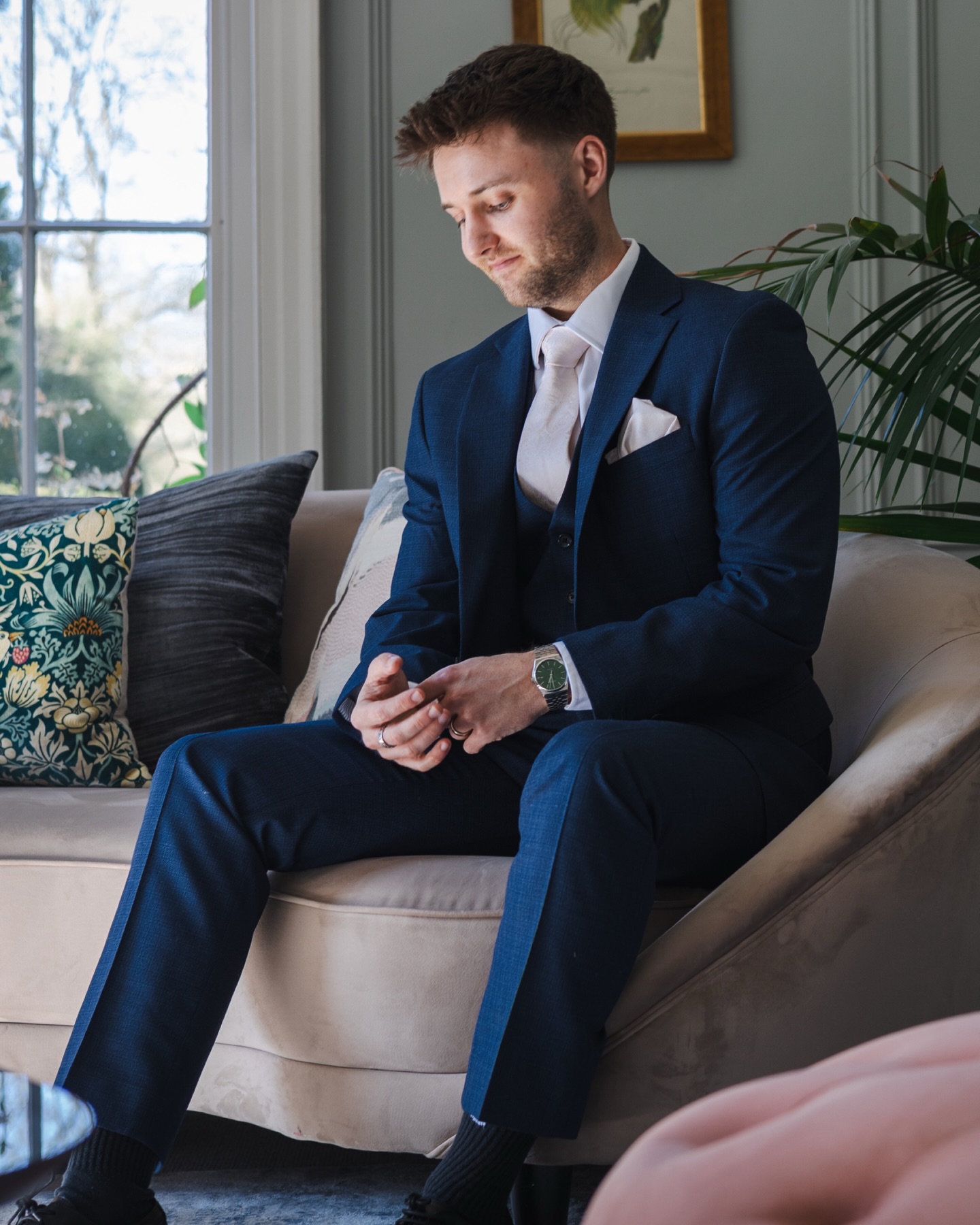 the groom counting down the moments until he sees his bride to be