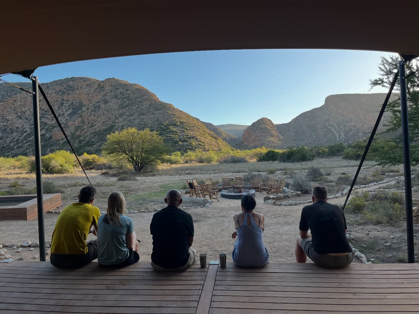 Although we came for the hiking and nature experience, it’s time to say something about the facilities:
Think simple, beautiful glamping that blends effortlessly into the landscape, with a minimal ecological footprint. Each camp is tiny, quiet and a little bit special — the kind of place where you immediately slow down.
You’ve got proper beds, thoughtful spaces, private rooms for two with a private toilet, and that feeling of being far away from everything without giving up comfort. It’s intimate and exclusive in the best way.
Every camp has a communal kitchen with everything you need, hot-water showers, a campfire waiting for you (wood supplied), and a pool to cool off in at the end of a long day of hiking. Evenings are for post-hike swims, firelight, easy conversations, and ridiculously starry night skies.
Your luggage — and cold beer — gets transported from camp to camp, so you only carry the basics while hiking. And honestly? I’ve never eaten so classy on an overnight trail before.
There are five different camps along the route, all booked through one central system — simple and stress-free.
The only challenge? Getting a spot. The trail isn’t even officially open yet, and 2026 is already almost fully booked.
#footprintsjournies #baviaancanyontrail #hikinglife #slowliving #glampingvibes #traillife #getoutside #natureescape #hikersofinstagram #wildernessculture