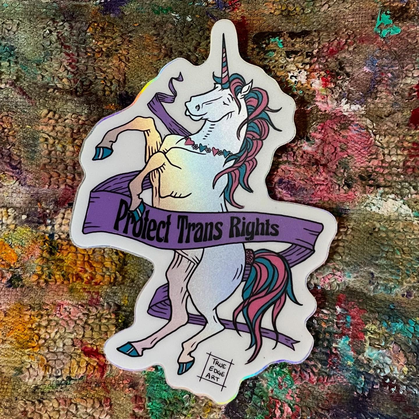 Thank you to everyone who has bought a Trans Rights sticker! All proceeds are going to protect trans rights - which makes me absolutely over the moon that this is my most popular shop item right now!!! I’ll be making a group donation after the holidays. There’s still time to pick one up!
✨🩷🩵🤍🖤✨
⚔️
I also have a Harry Potter sticker where all proceeds are going to protect trans rights. I made this sticker years and years ago and usually don’t offer it for sale because I don’t want to promote that evil wicked transphobe… I felt guilty having it even around! But then I was thinking… there are still people who have fond memories of those books, but also don’t want to give any money to that horrible human. So it’s for sale on my shop with going to protect trans rights! Otherwise it’s just collecting dust in my desk… now hopefully it’ll do some good!