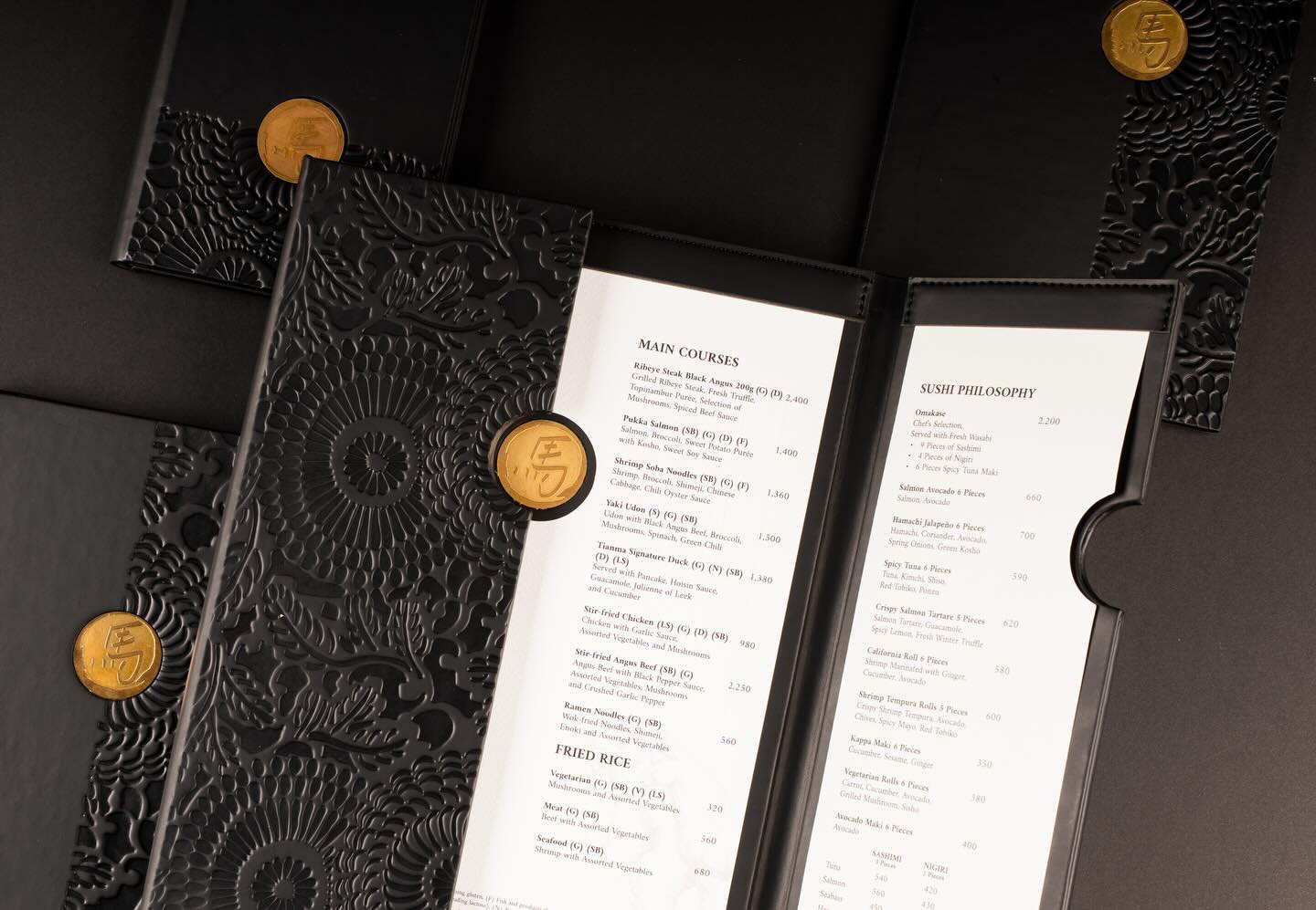 Crafted to be felt before it’s seen.
High-quality black leather menus for Tianma – @stregiscairo , finished with intricate embossing and a signature brass coin — where material, detail, and craftsmanship meet.
.
Photography by: @minaashraf_photography