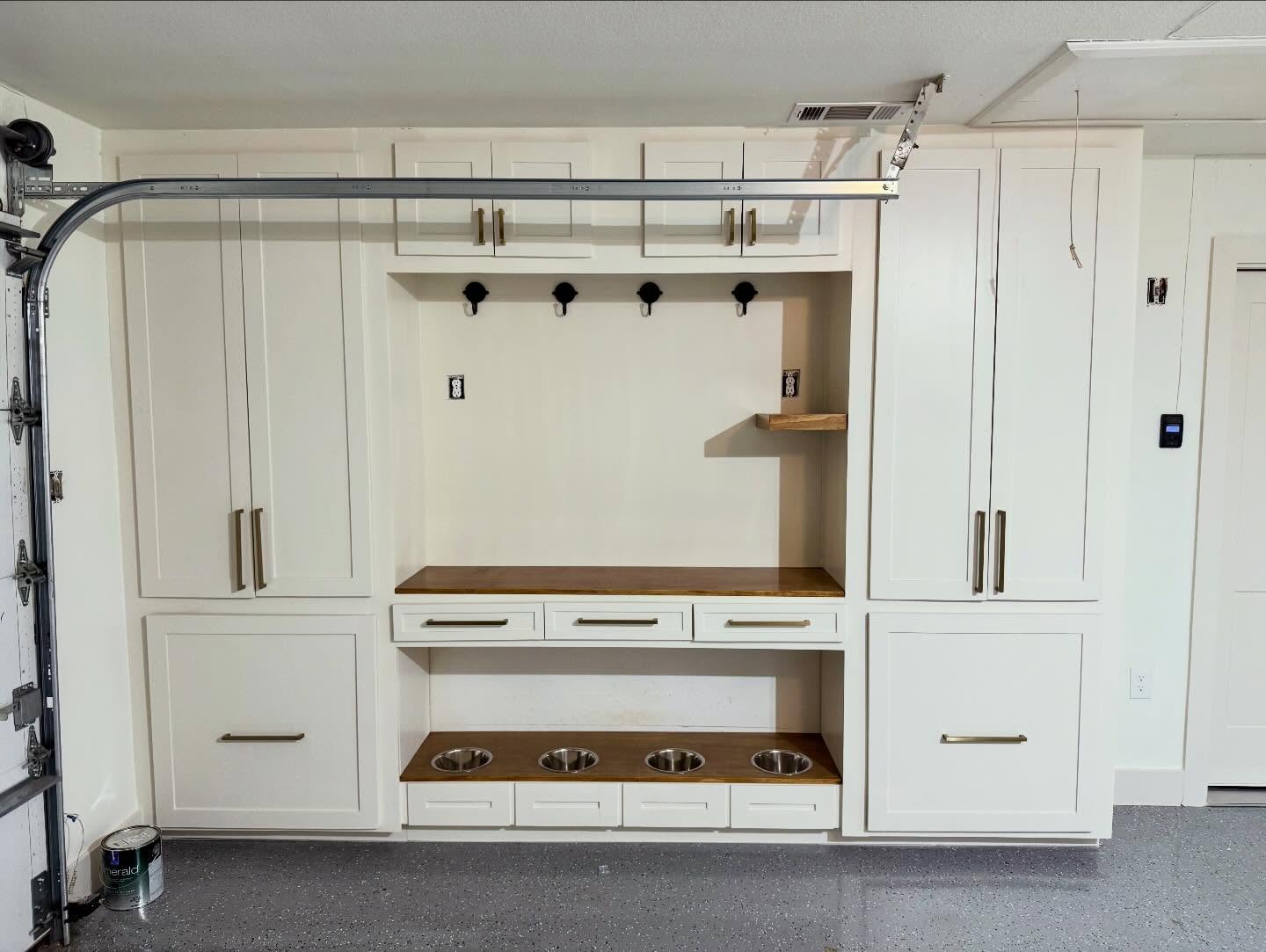 Garage storage anyone? We transformed a standard garage to a storage paradise. For this client, it wasn’t just about gaining storage, it was about creating a space for their dogs with custom space for cage, dog food, and bowls (with a backsplash!). It was great to be able to serve a local client who fosters and cares for animals the way they do. Grateful for the wonderful clients we are able to serve! #garageconversion #dfwremodeling