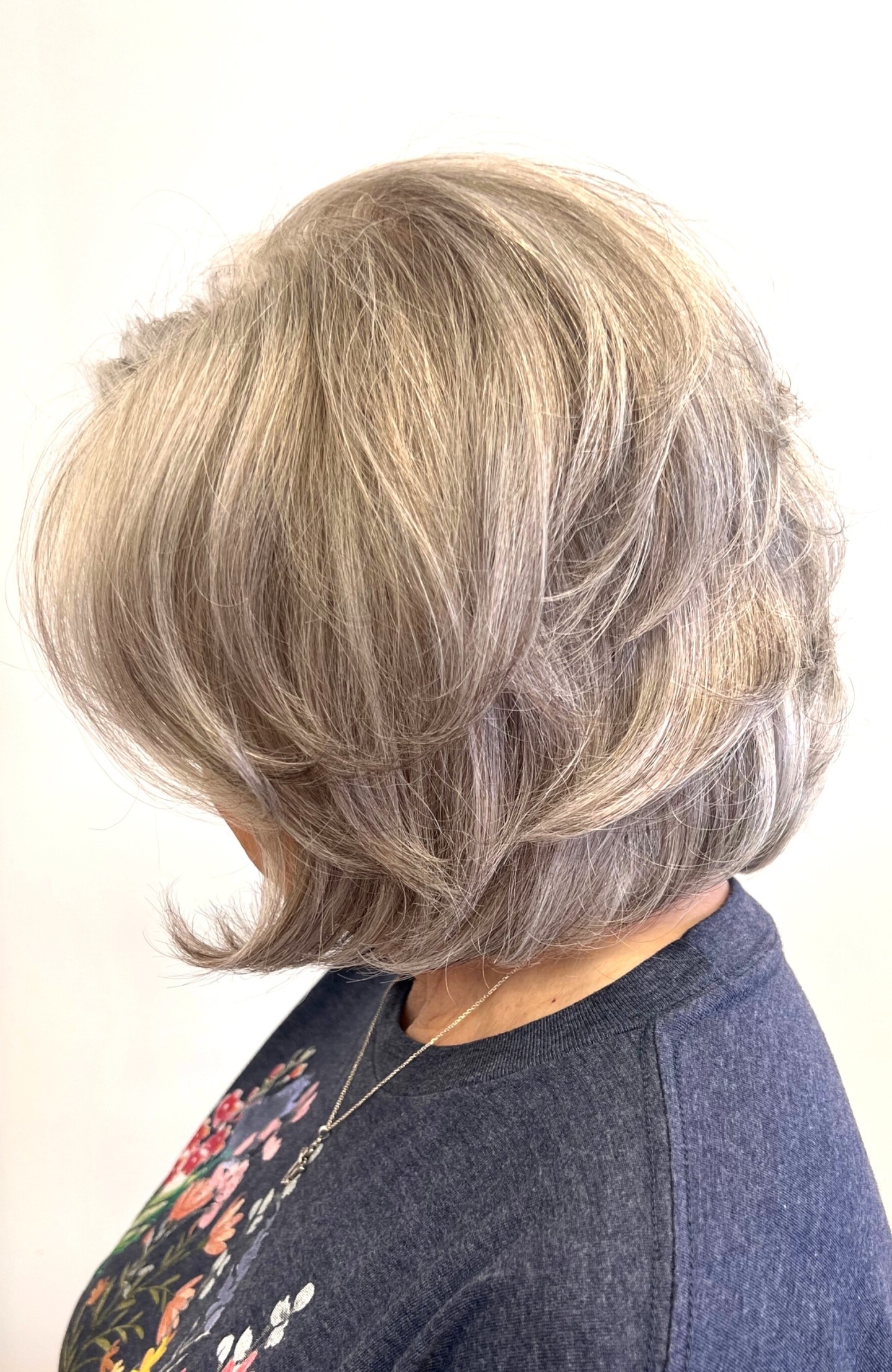 Grey Blending...
Pam had been coloring her hair a light, golden blonde for many, many years to hide the white, but have a softer, warmer color. The grow out wasn't awful because she stayed so light.
However, in 2021, she decided to go cold turkey on coloring and let all that blonde grow out. Fast forward a few years, and she did a BIG chop. We cut all that blonde off. Now fast forward a few more months and she decided that while she didn't mind the white, she felt a little too light and wanted to darken things in, but make it natural and have it fit with her skin tone.
We added a lot of tiny little steel brown colored lowlights to mimic the small amount of "pepper" she had mixed into her "salt" with a Demi-permanent color.
This color will fade slowly over time and leave her looking super natural, with no harsh lines of grow out. She gets it done every 4-5 months.
We blended the white, while keeping her maintenance minimal, and letting her GORGEOUS white shine through and be the star.
Grey CAN be gorgeous! Don't let anyone tell you different. Drop a 😍 if you hope for this kind of white/grey when your time comes!!
hair by: @hairgeniusamanda
.
.
.
.
.
#houstonhairstylist #cypresshairstylist #tomballhairstylist #townelake #townelakelife #houstongreyhair #greytransitions